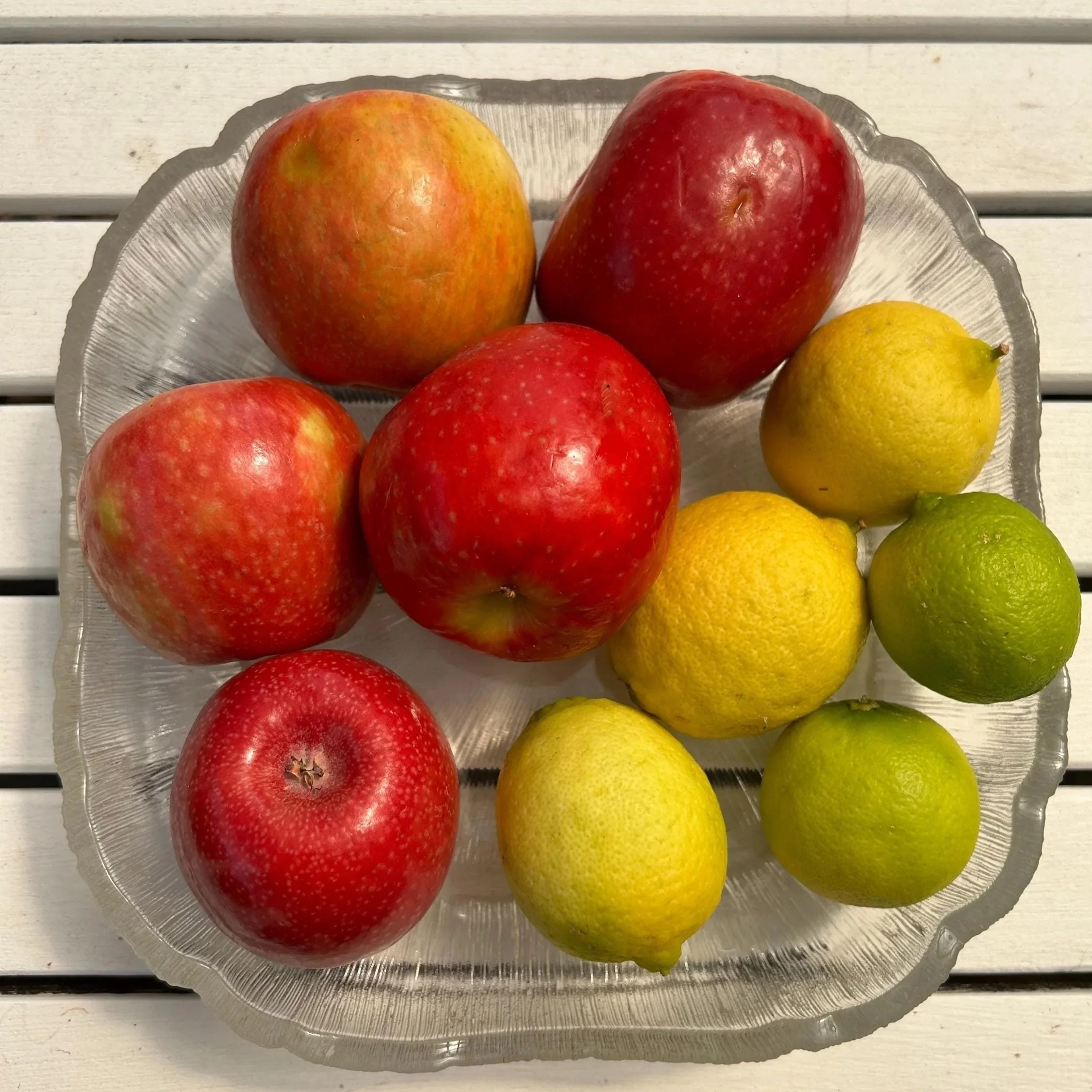 Fruit-filled bowl from above showing square rim and depth