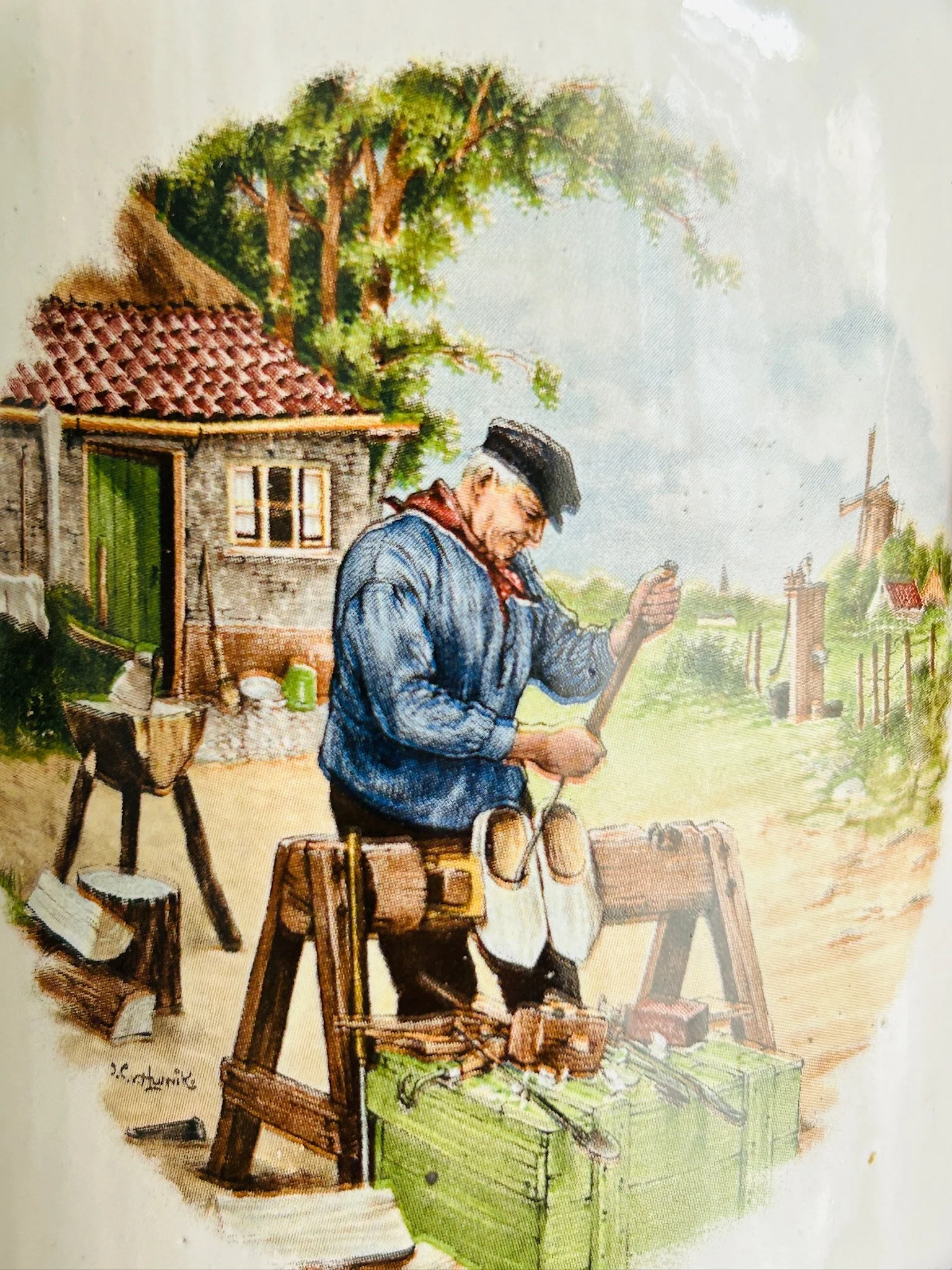 Close-up of the cobbler village scene on the second pot, highlighting the fine painted detail and rustic Dutch character.