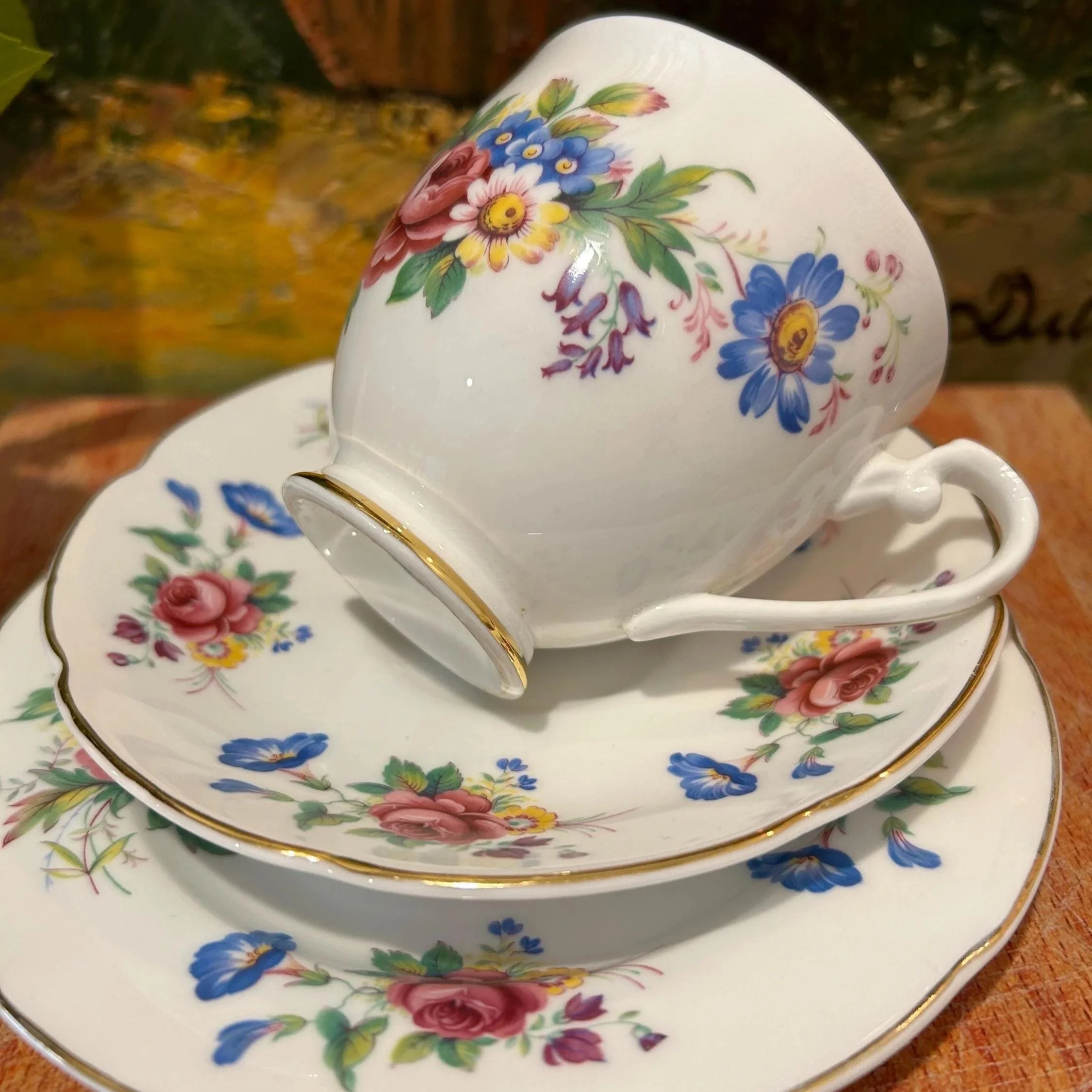 Cup resting on saucer to show gold rim and delicate balance
