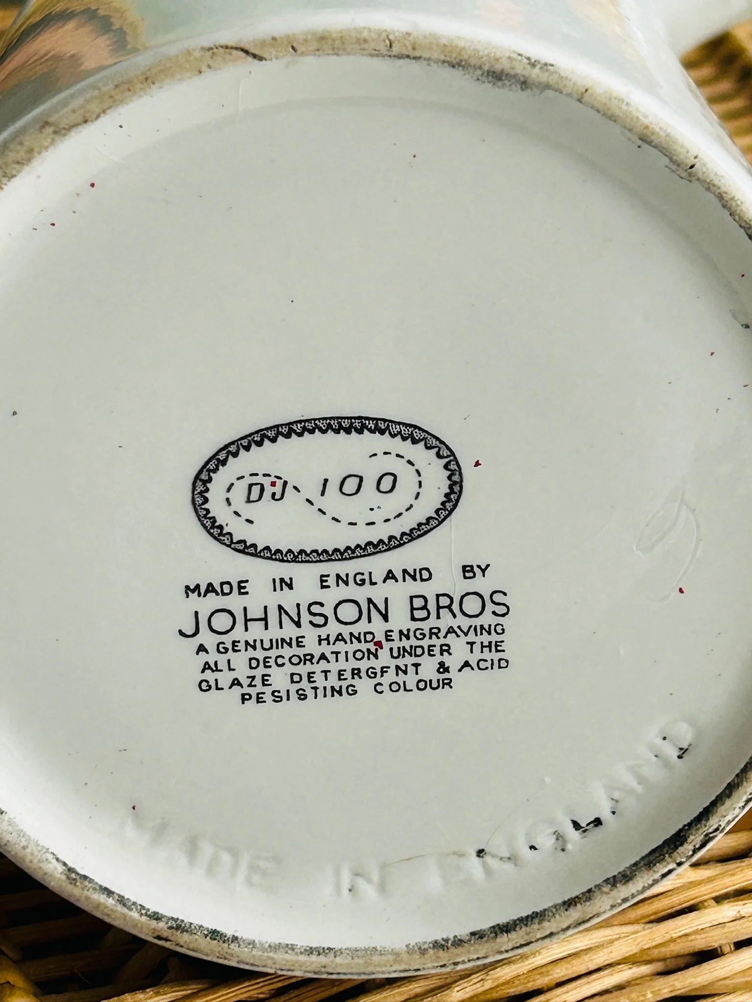 Close-up of the base backstamp reading Johnson Bros Made in England, showing the maker’s mark and production details on the underside.