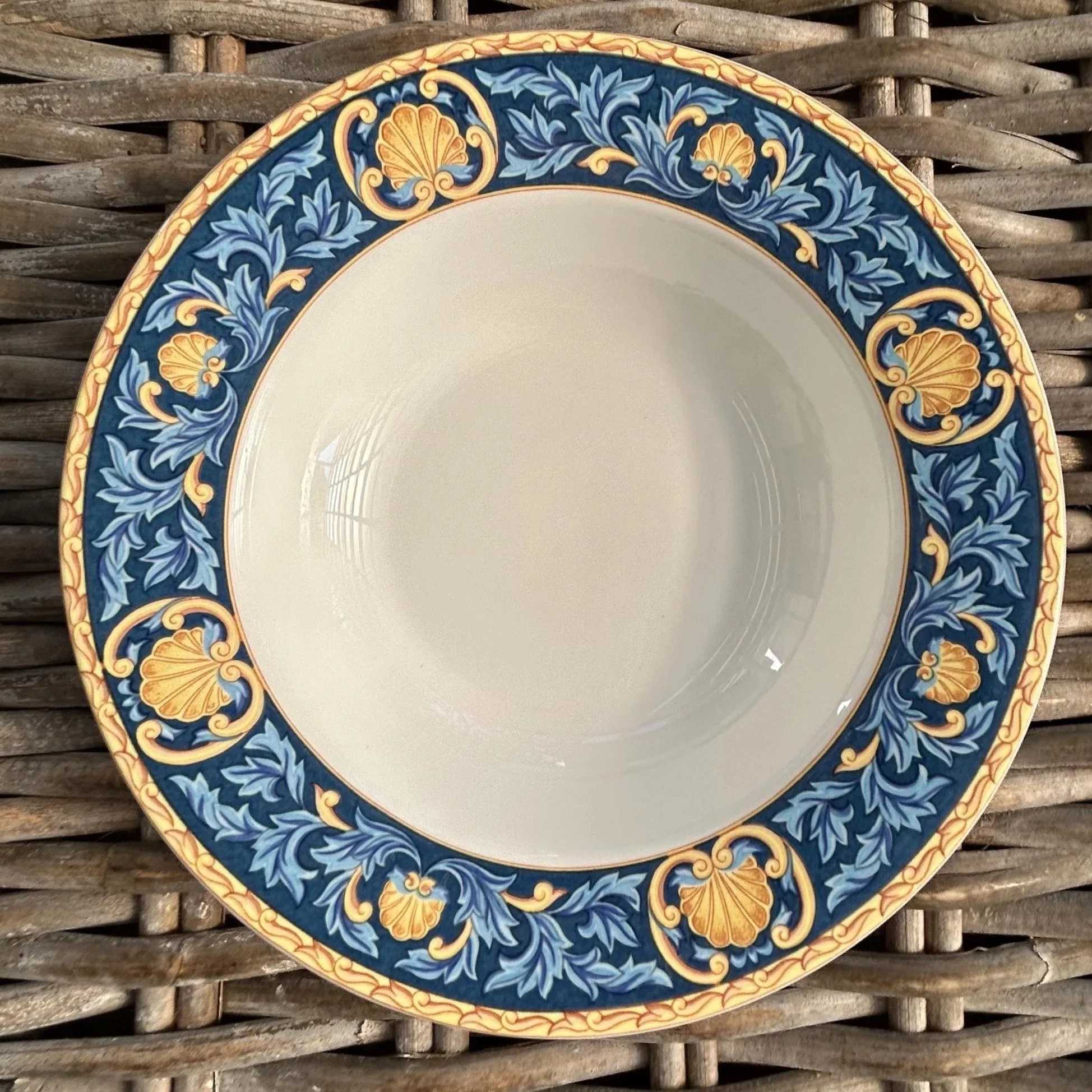 Full top view of single bowl with blue and gold border