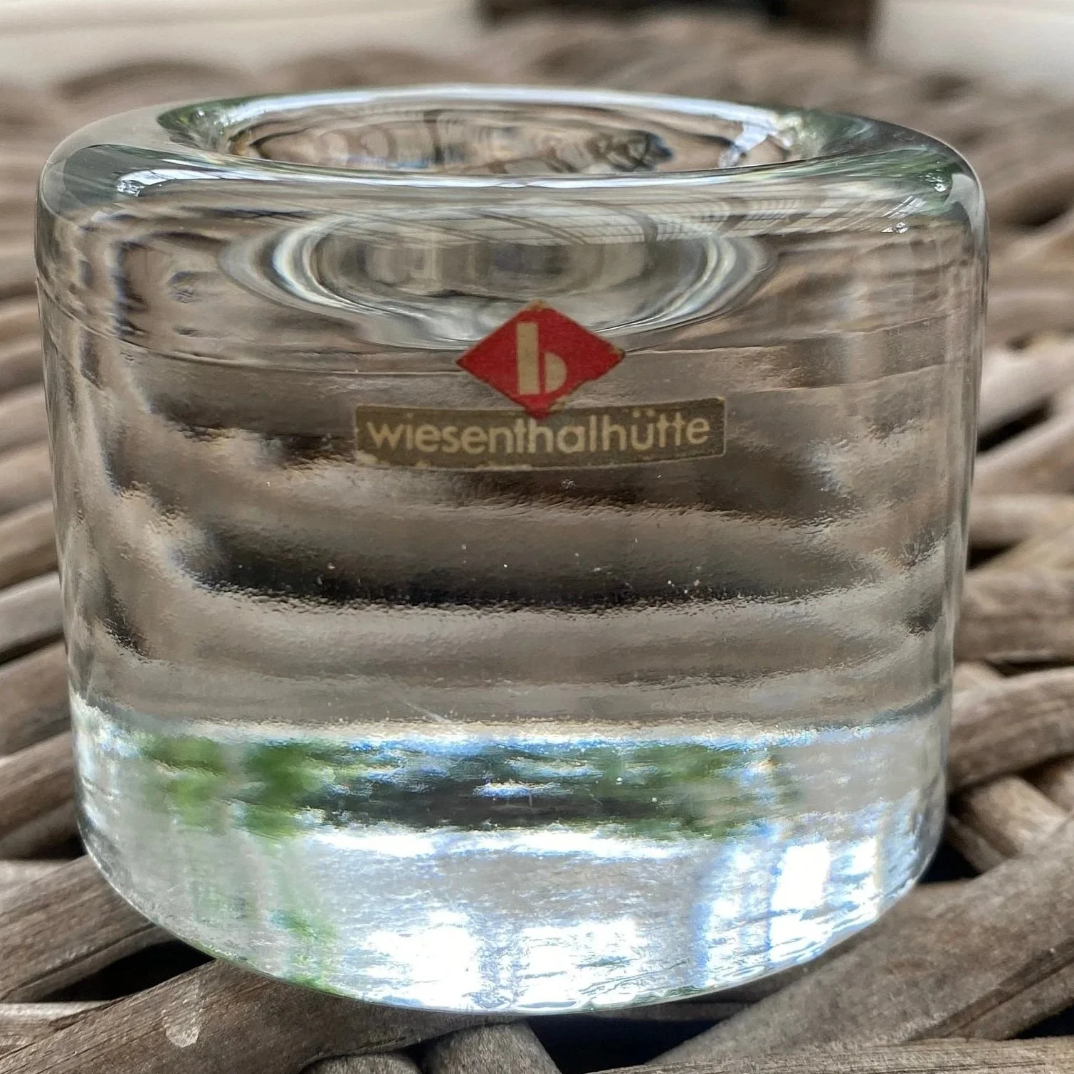 Close-up of the Wiesenthalhütte maker’s sticker on the side of the clear glass holder