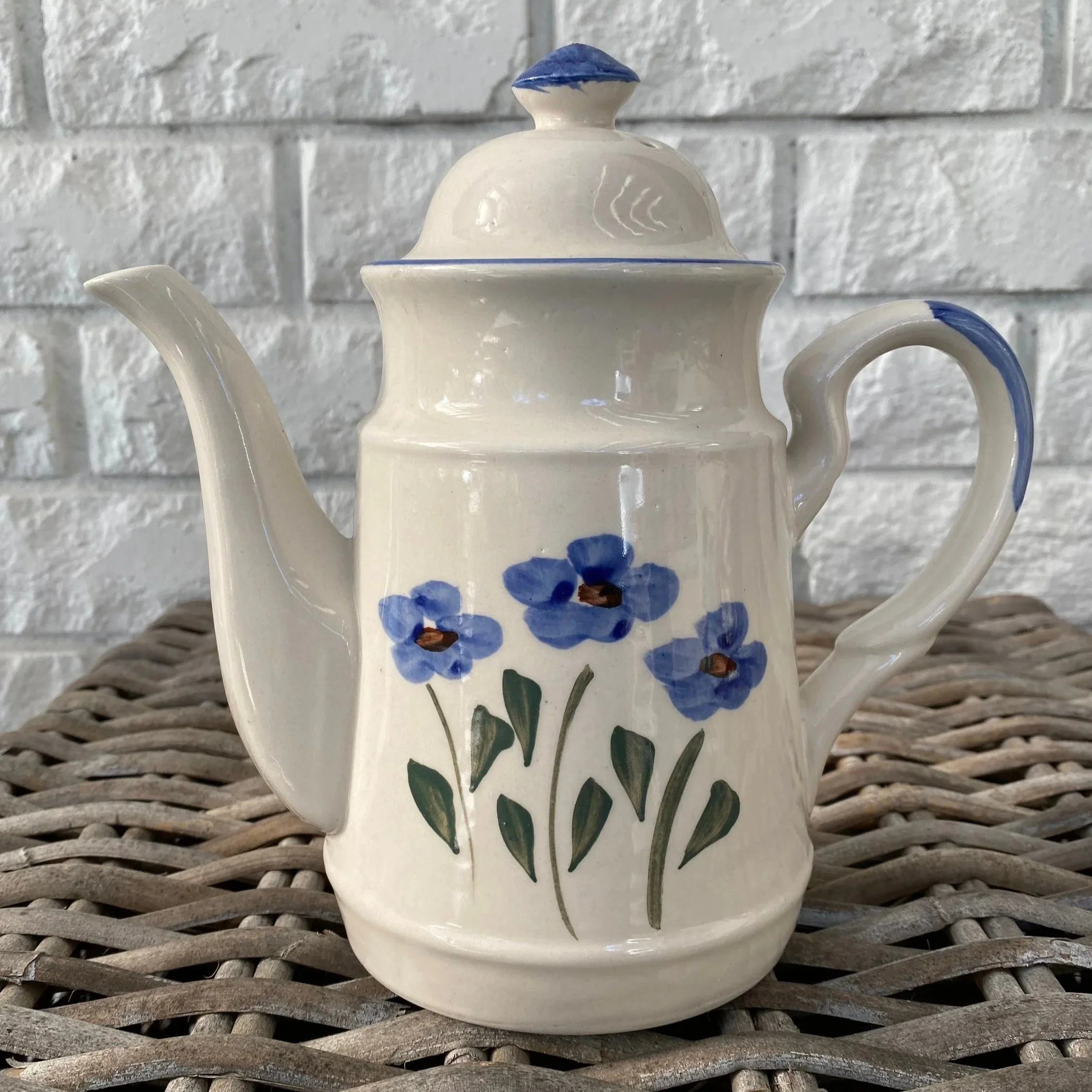 Tall coffee pot with lid, featuring blue flower design and curved handles