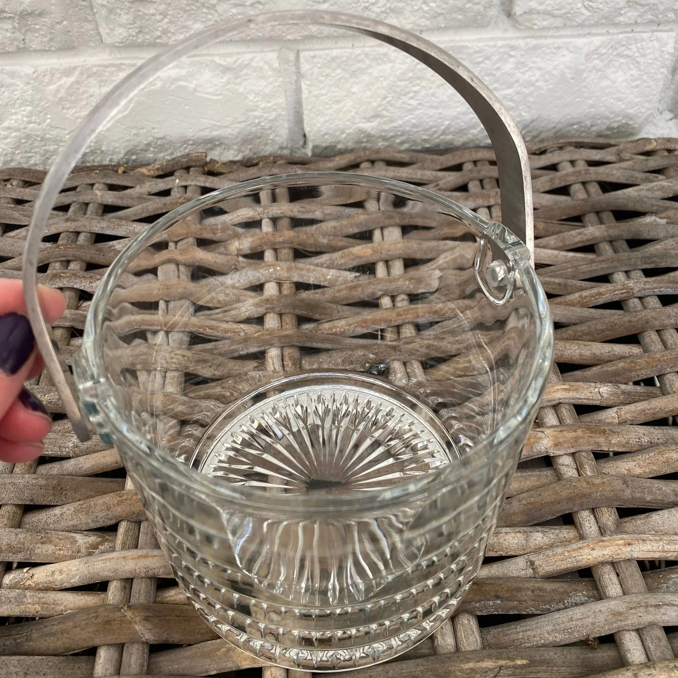 Top-down view showing open bucket with metal handle lifted