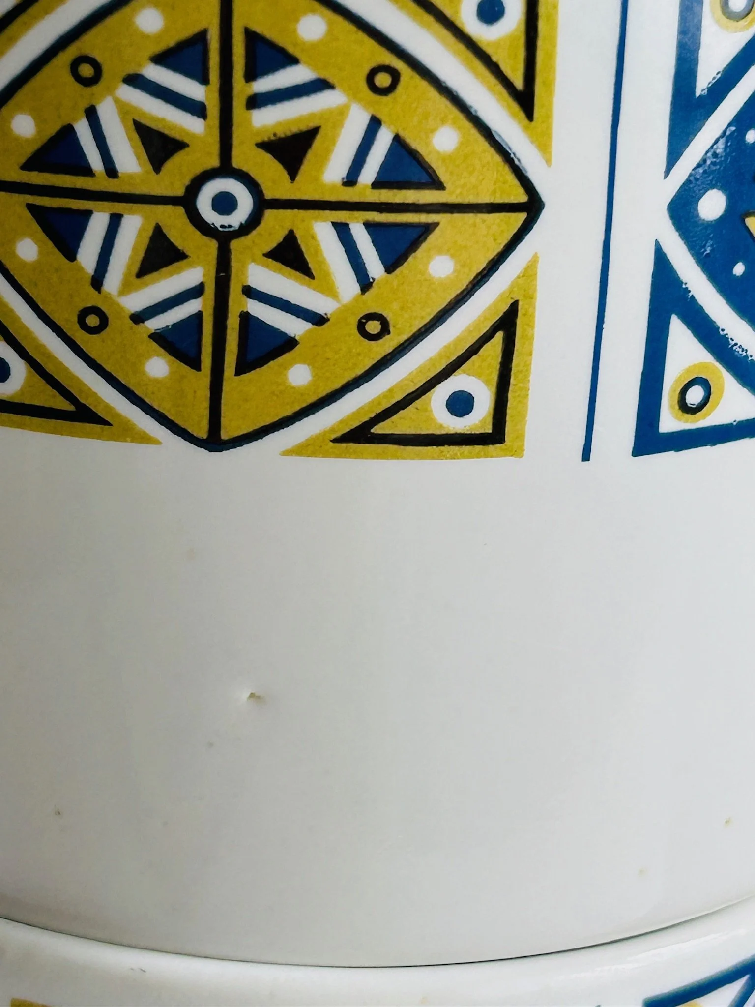 Alternate group view of the four matching Staffordshire Midas cups showing uniform pattern placement.