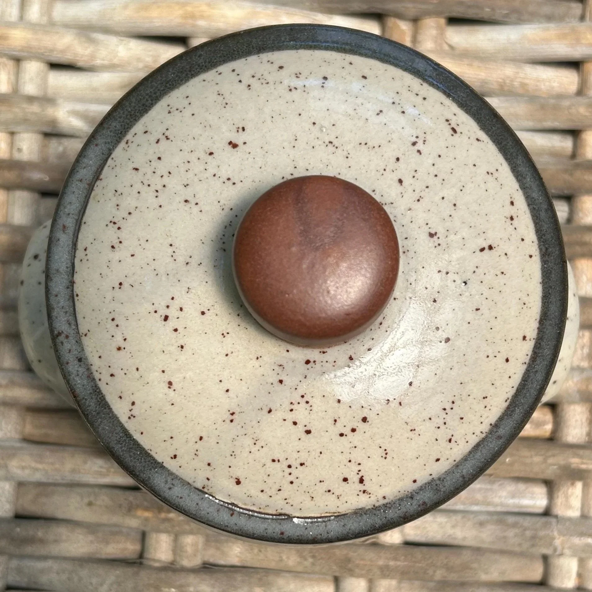 Top-down view showing rounded lid with unglazed knob