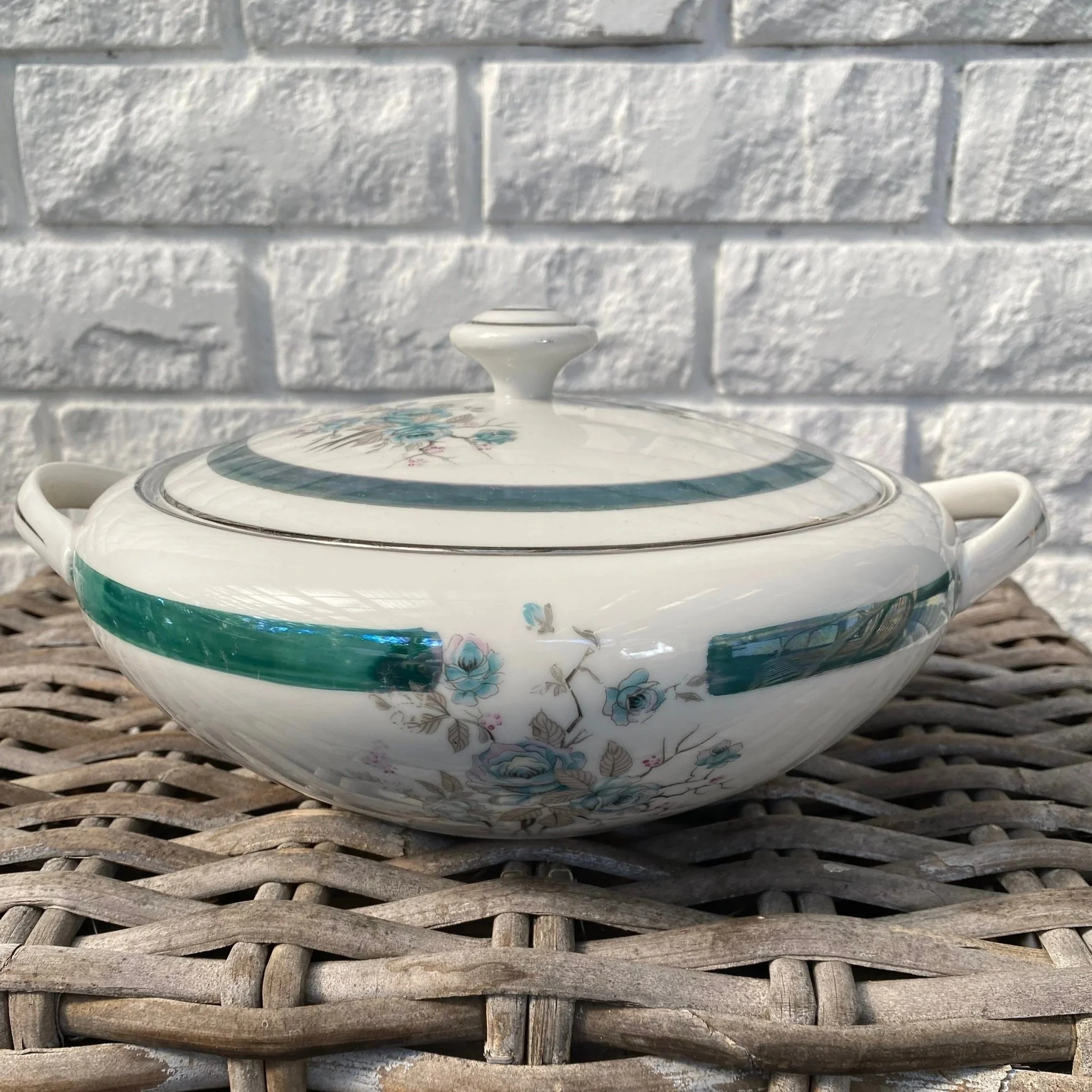 Osaka China porcelain tureen with lid and teal floral design on woven surface