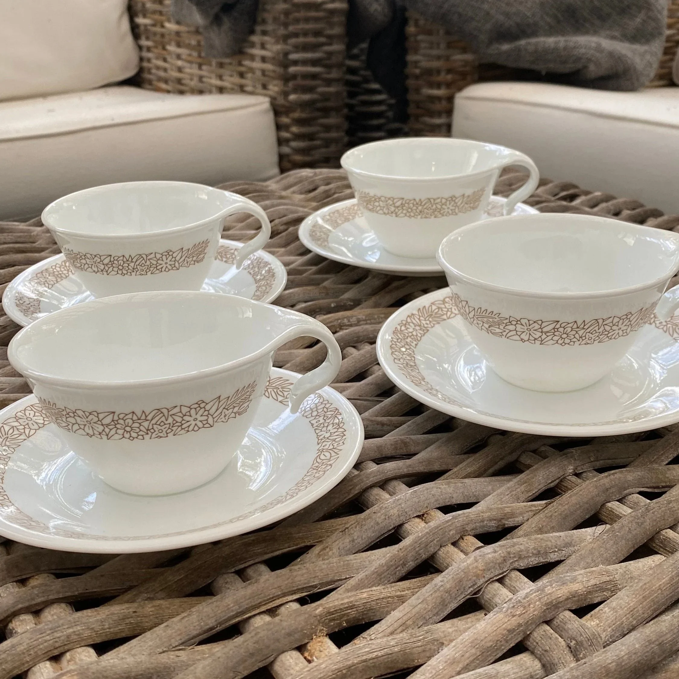 Vintage 1970s Corelle Woodland set of 4 teacups and saucers (plus spare cup) in durable Vitrelle glass. Brown floral pattern. Made in USA.
