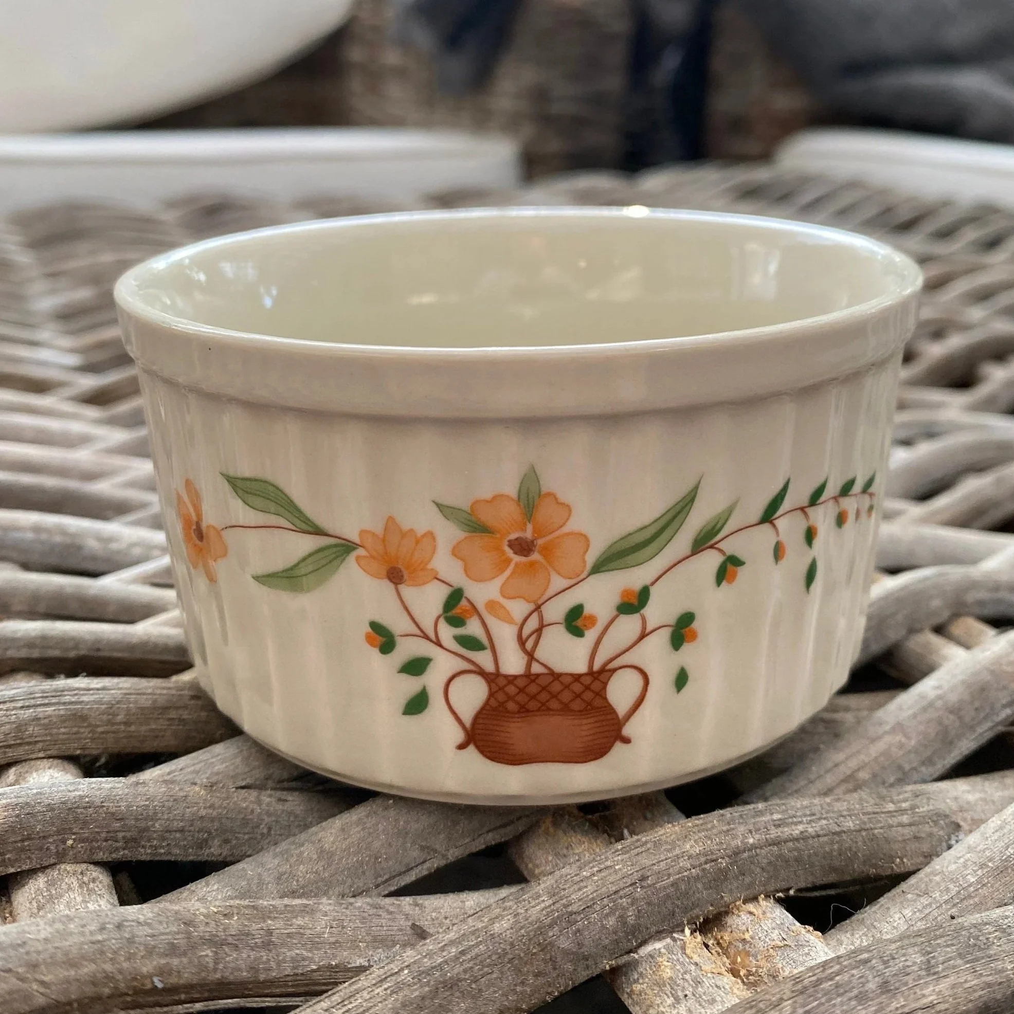 Angled front view of Countryside ramekin highlighting floral design and glossy glaze