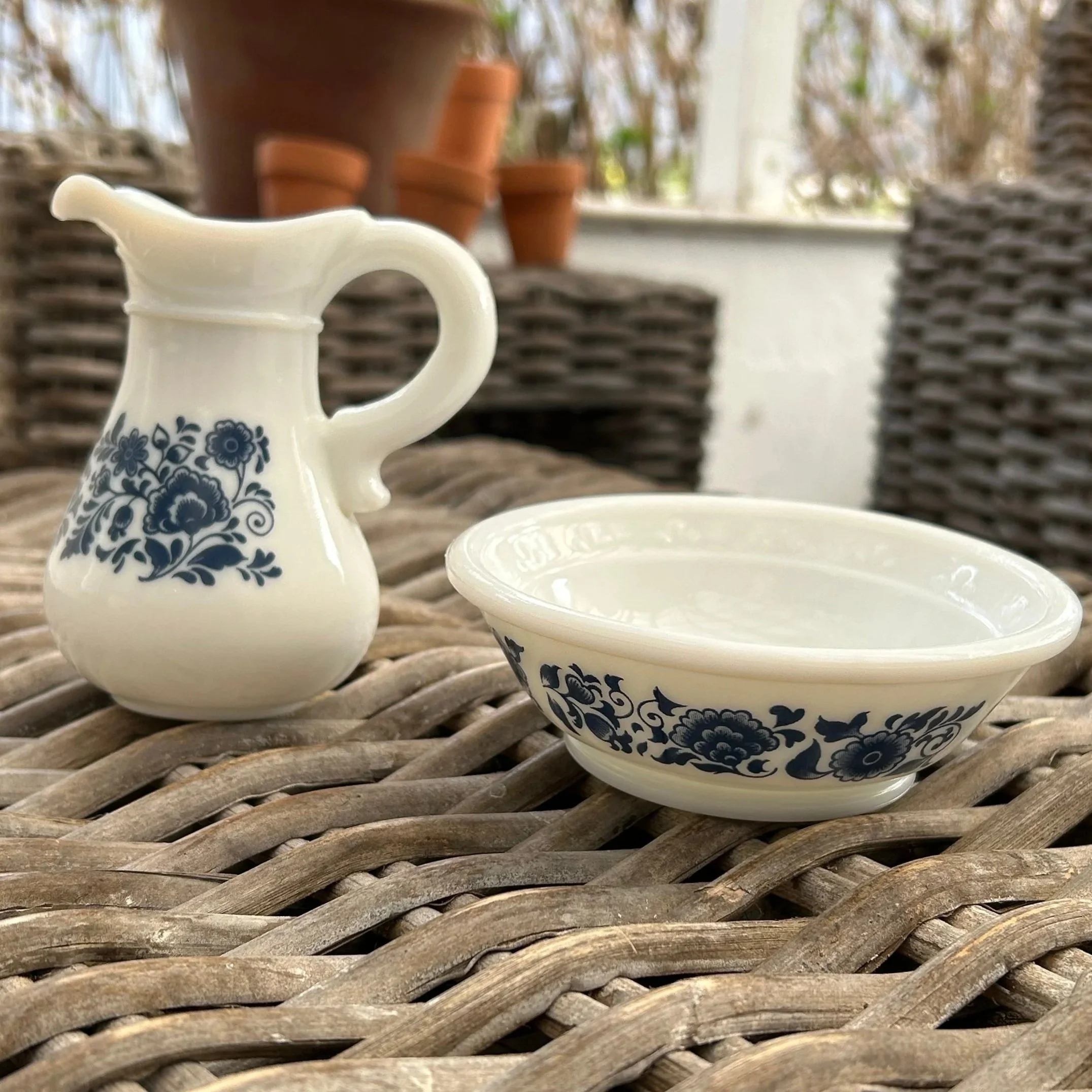 Base of bowl with floral transfer detail visible in hand