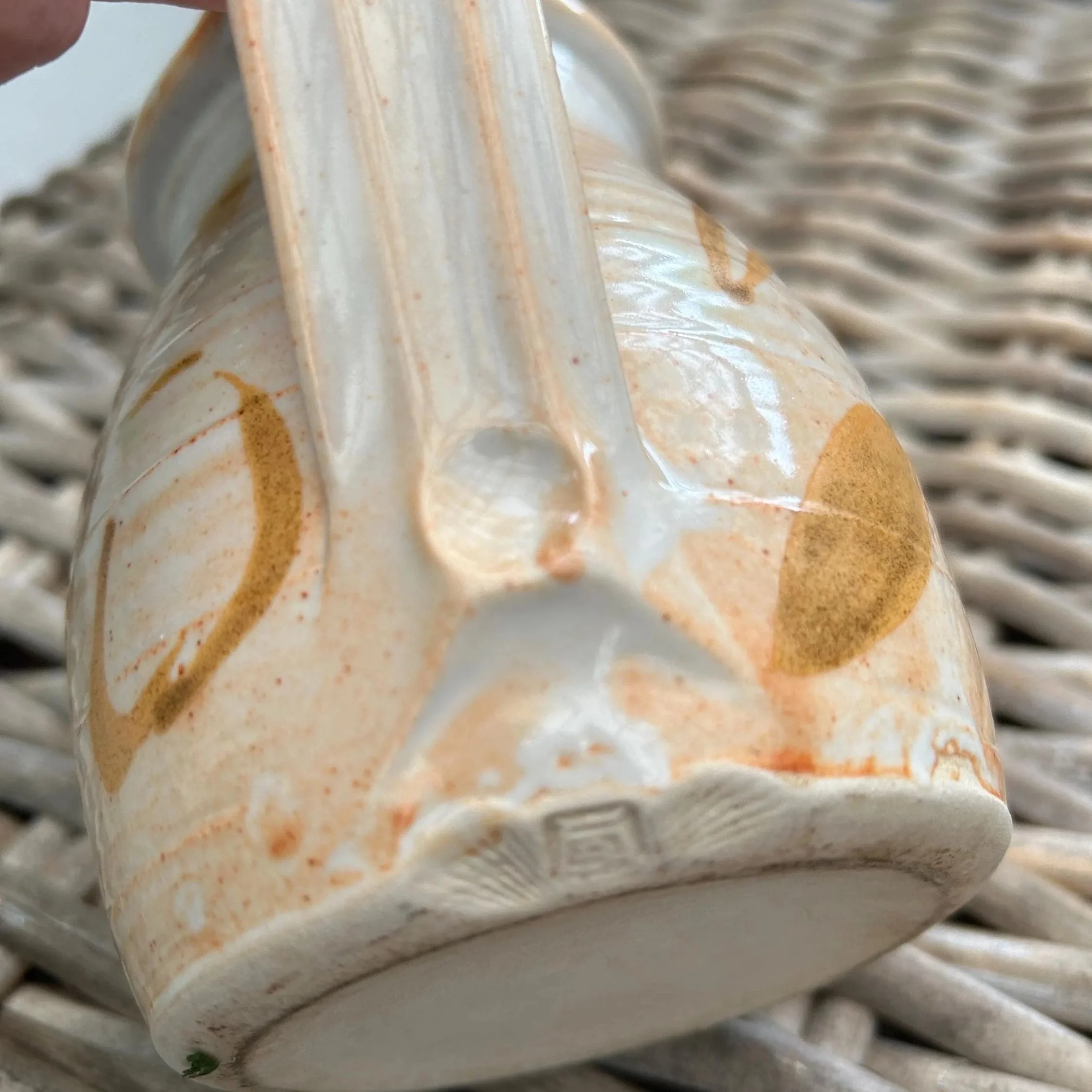 Detail of base and handle join with visible maker’s mark