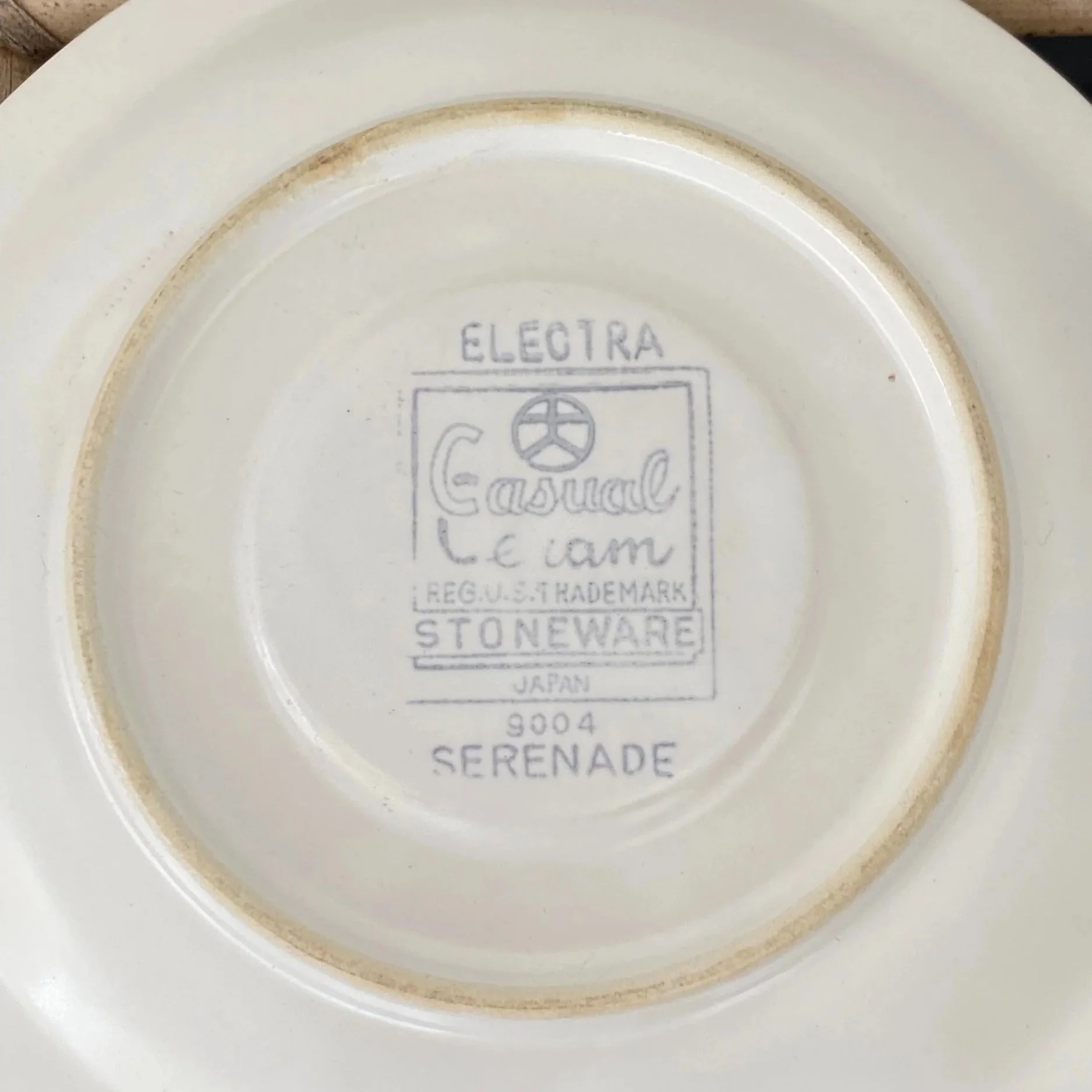 Underside of saucer showing maker’s mark: Electra Casual Stoneware Serenade 9004
