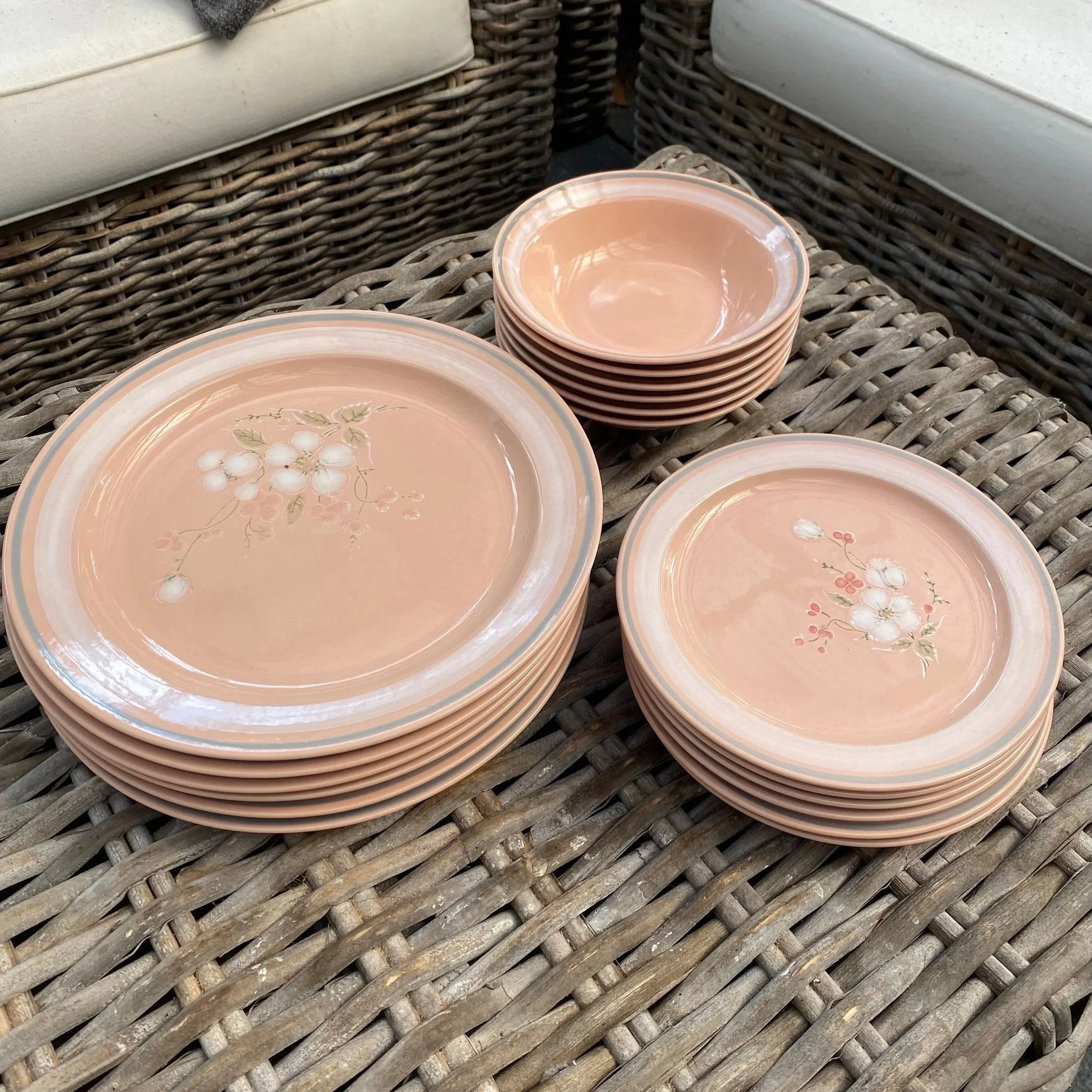 Full 18-piece Essentials set stacked neatly on wicker chair