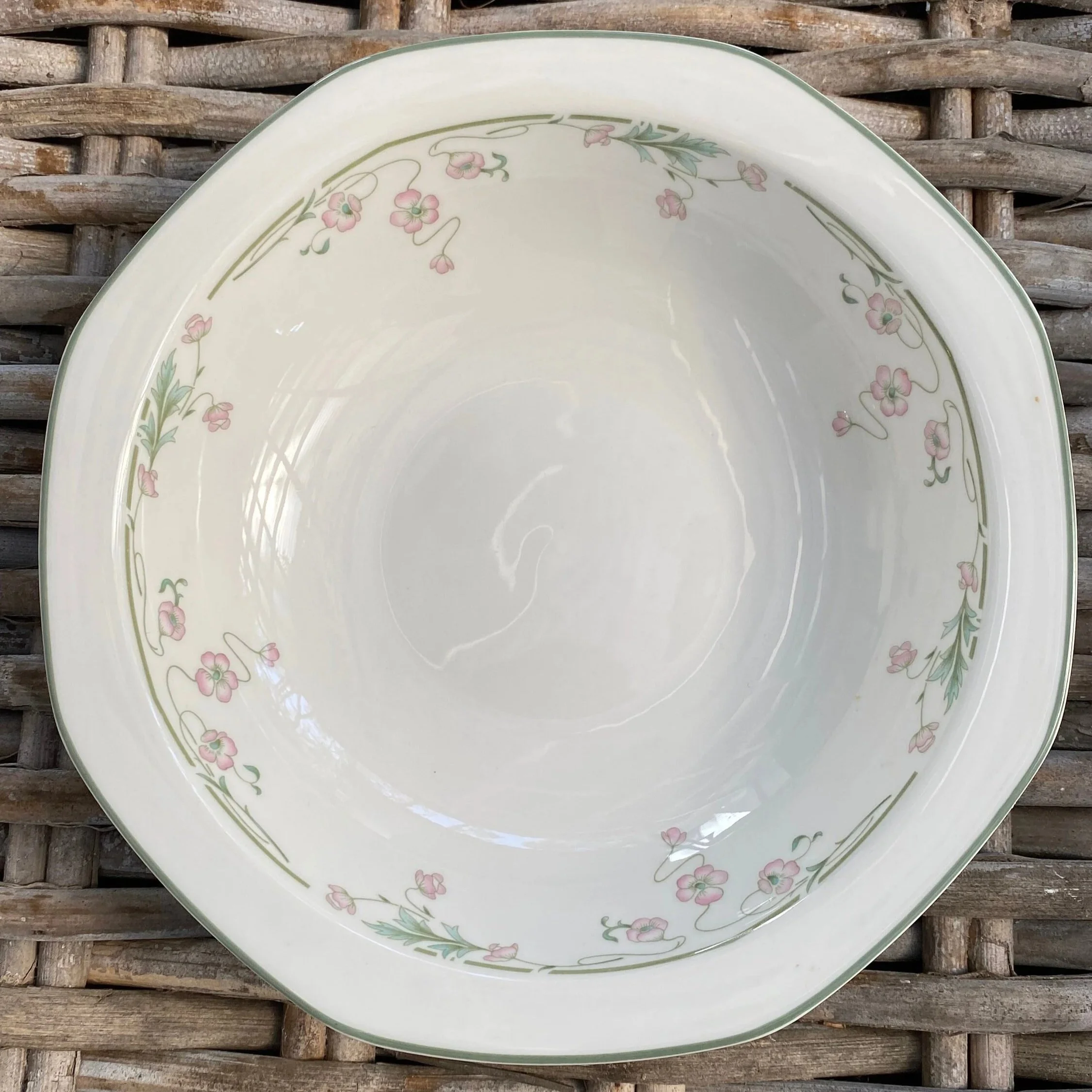 Overhead view of Royal Doulton “Caprice” bowl showing floral rim and hexagonal shape