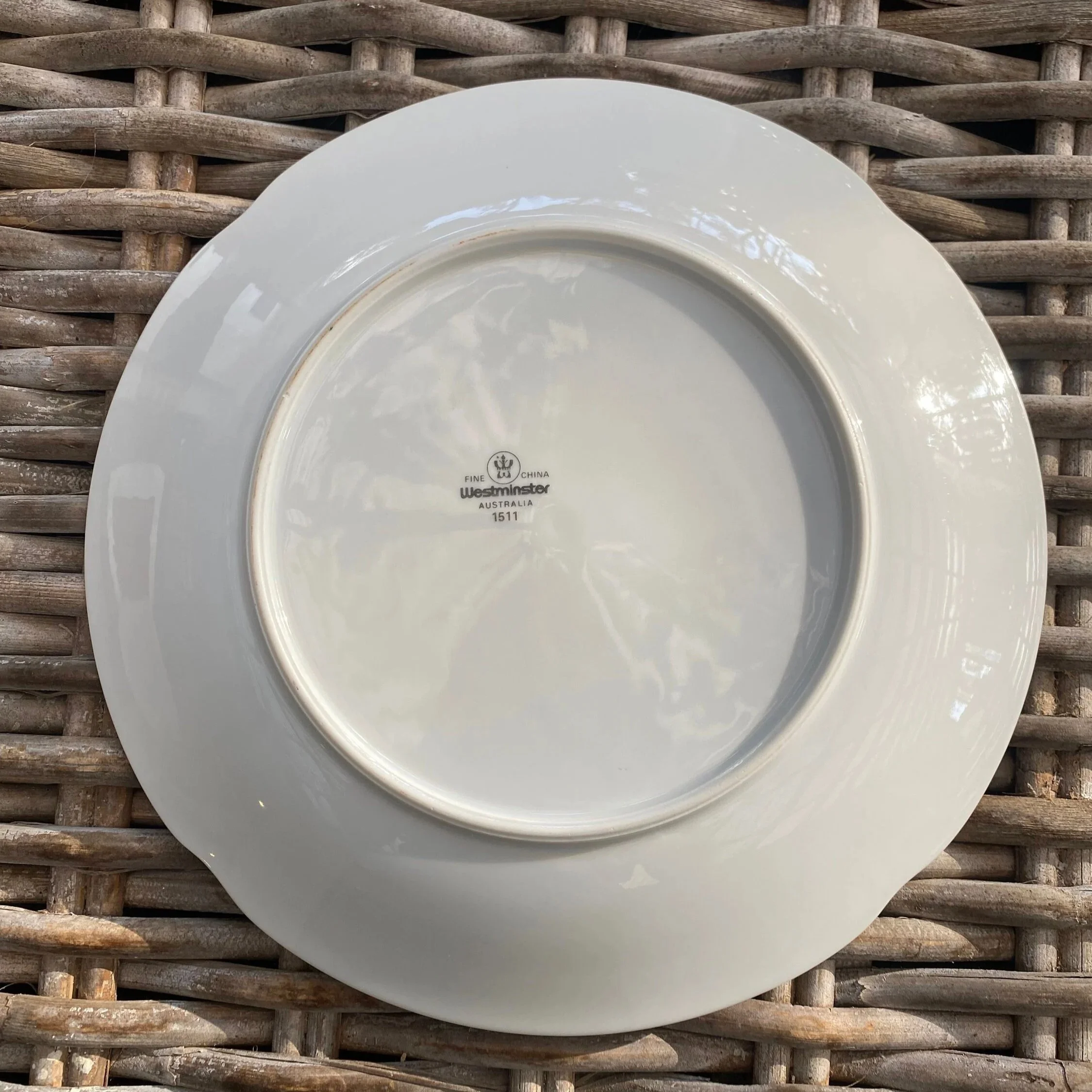 Underside of the plate showing the Westminster backstamp and footed base
