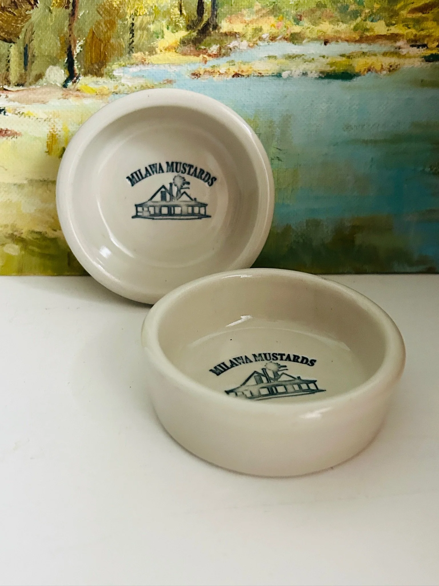 Pair of vintage Milawa Mustards bowls displayed together on a white surface