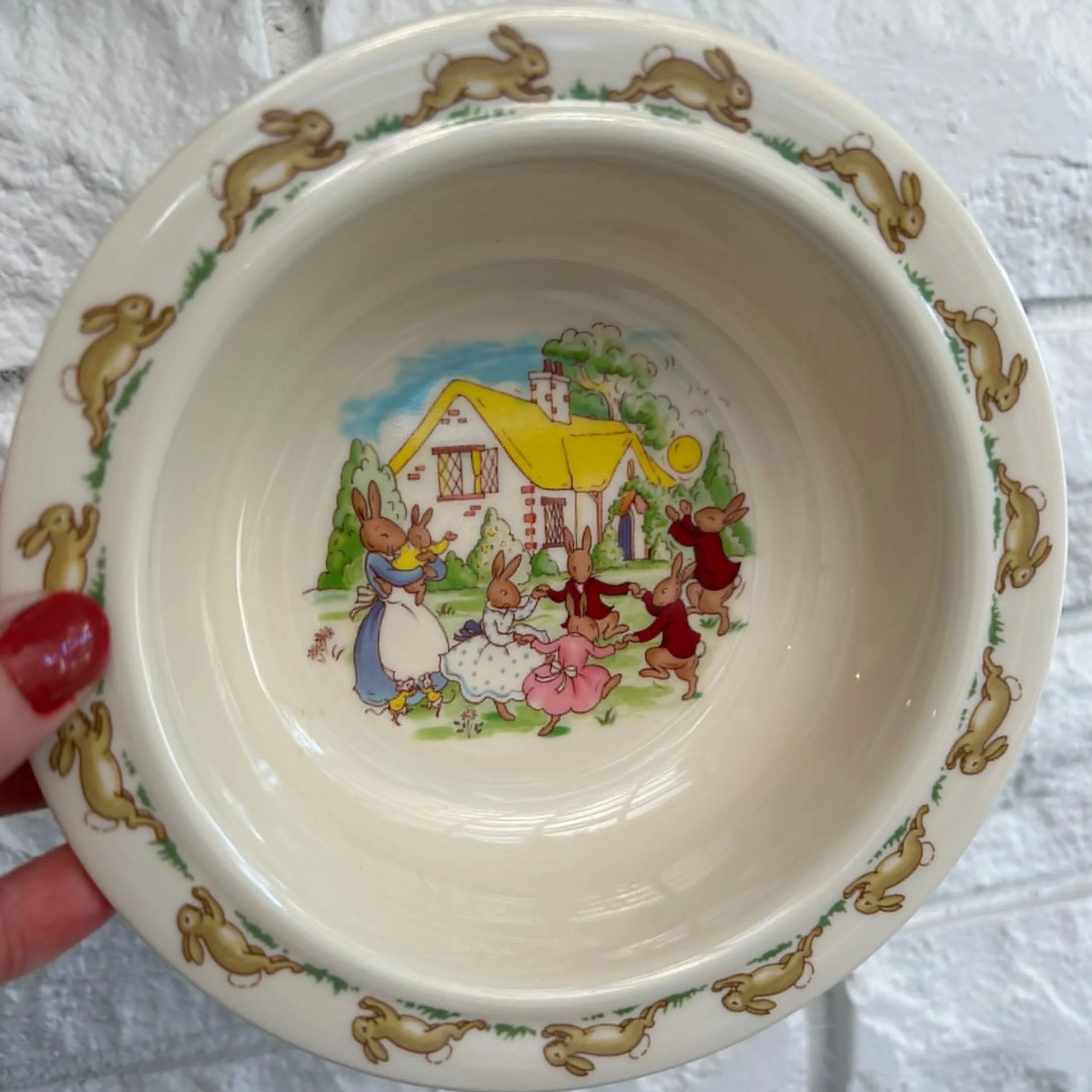 Royal Doulton Bunnykins cream melamine bowl with dancing bunny scene inside and Bunnykins rabbit border around the rim