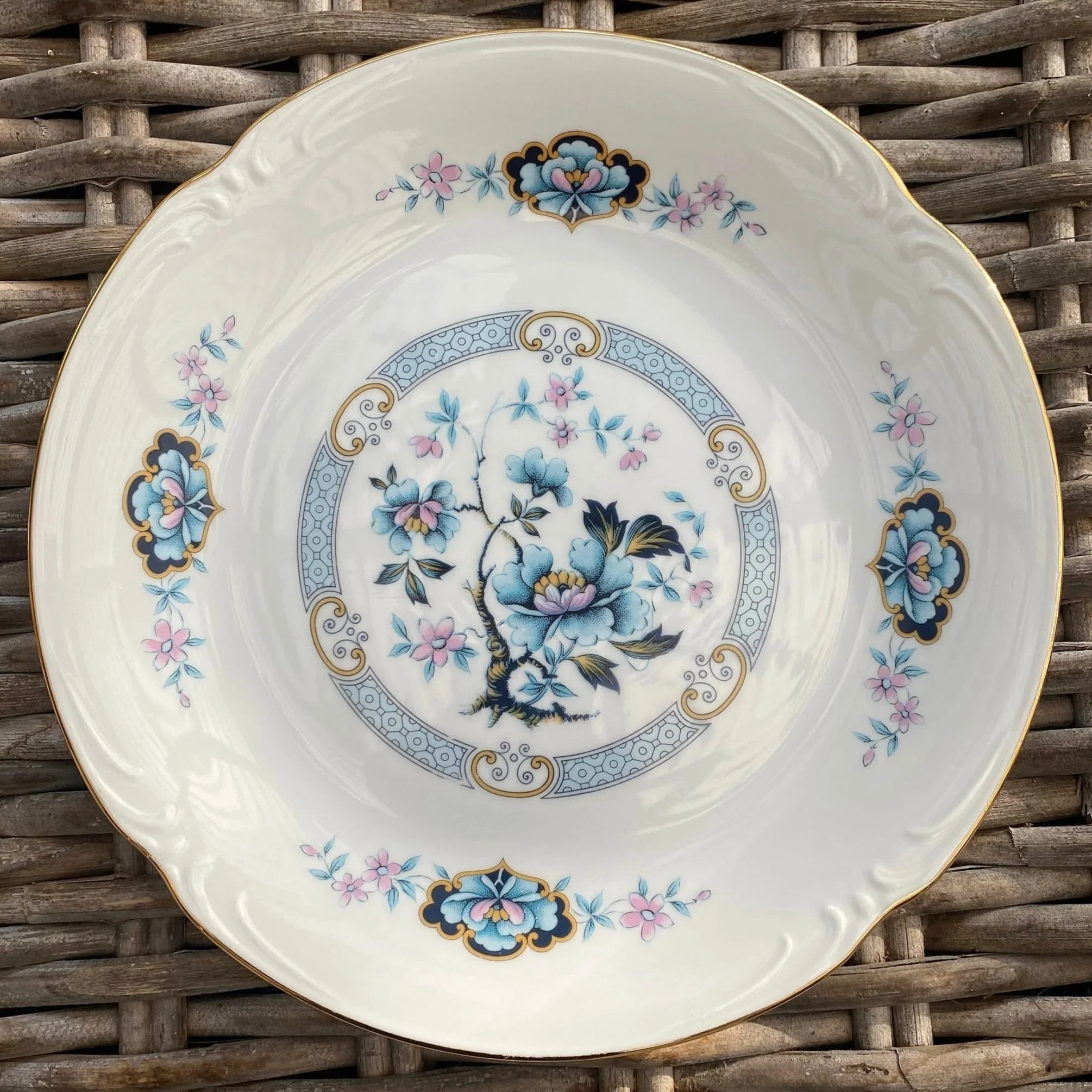 Overhead view of the Westminster fine china plate showing the full blue floral design and gold-trimmed rim