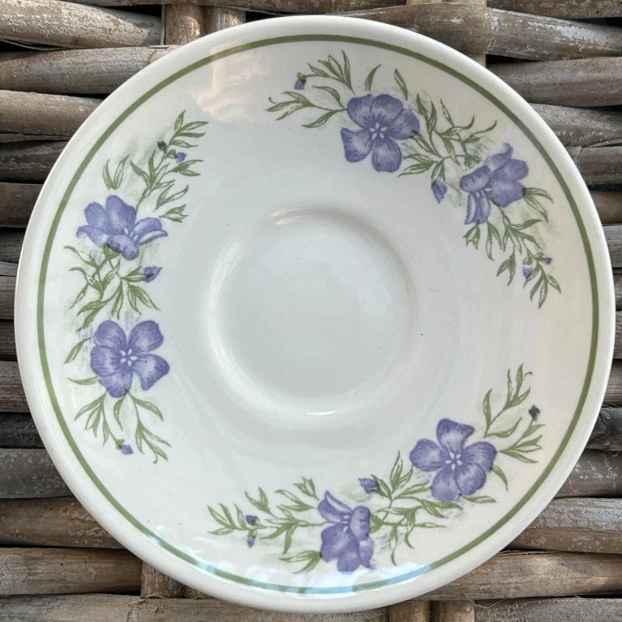 Full top view of Churchill ‘Chamomile and Herbs’ saucer with purple flowers