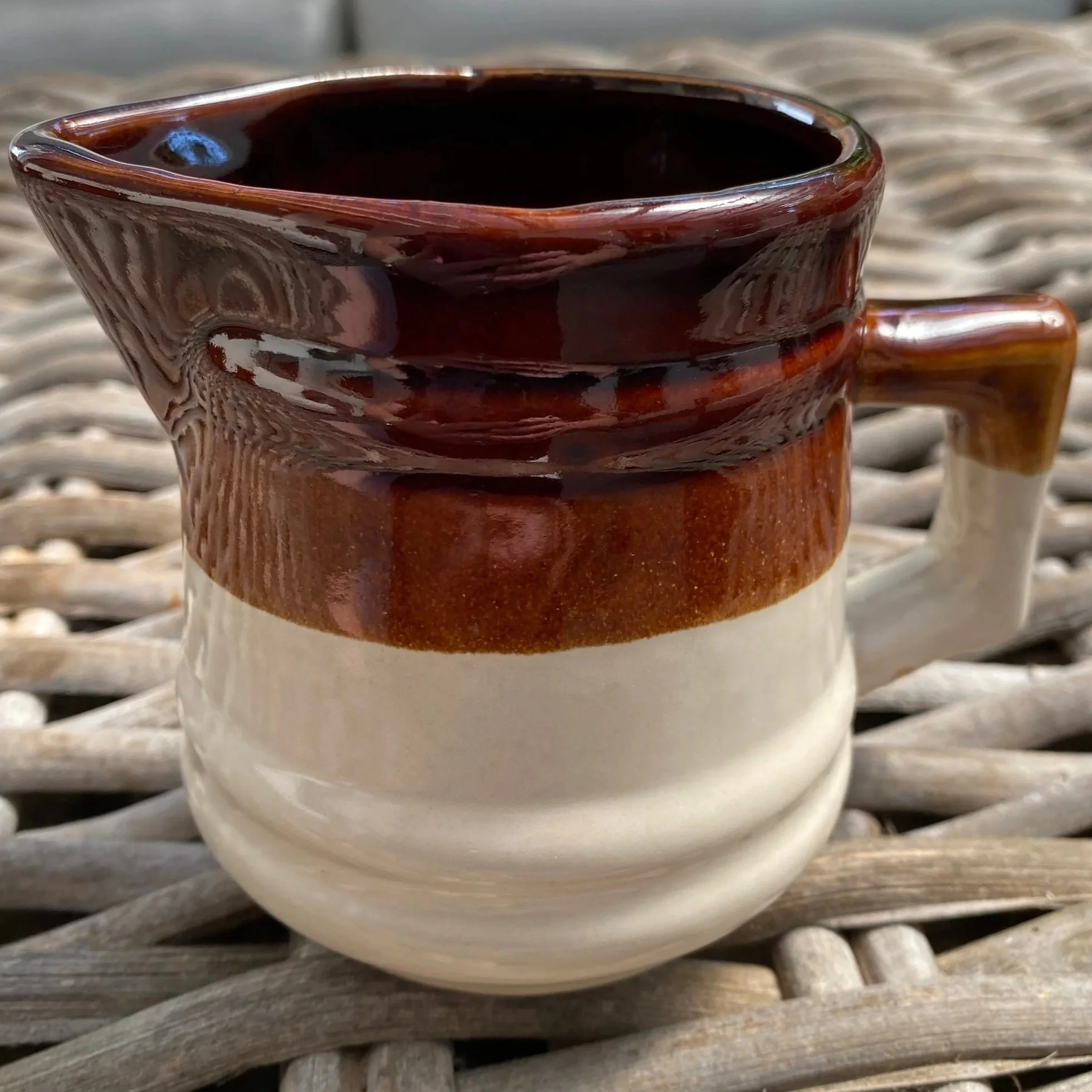 Creamer profile showing spout and handle with chip detail
