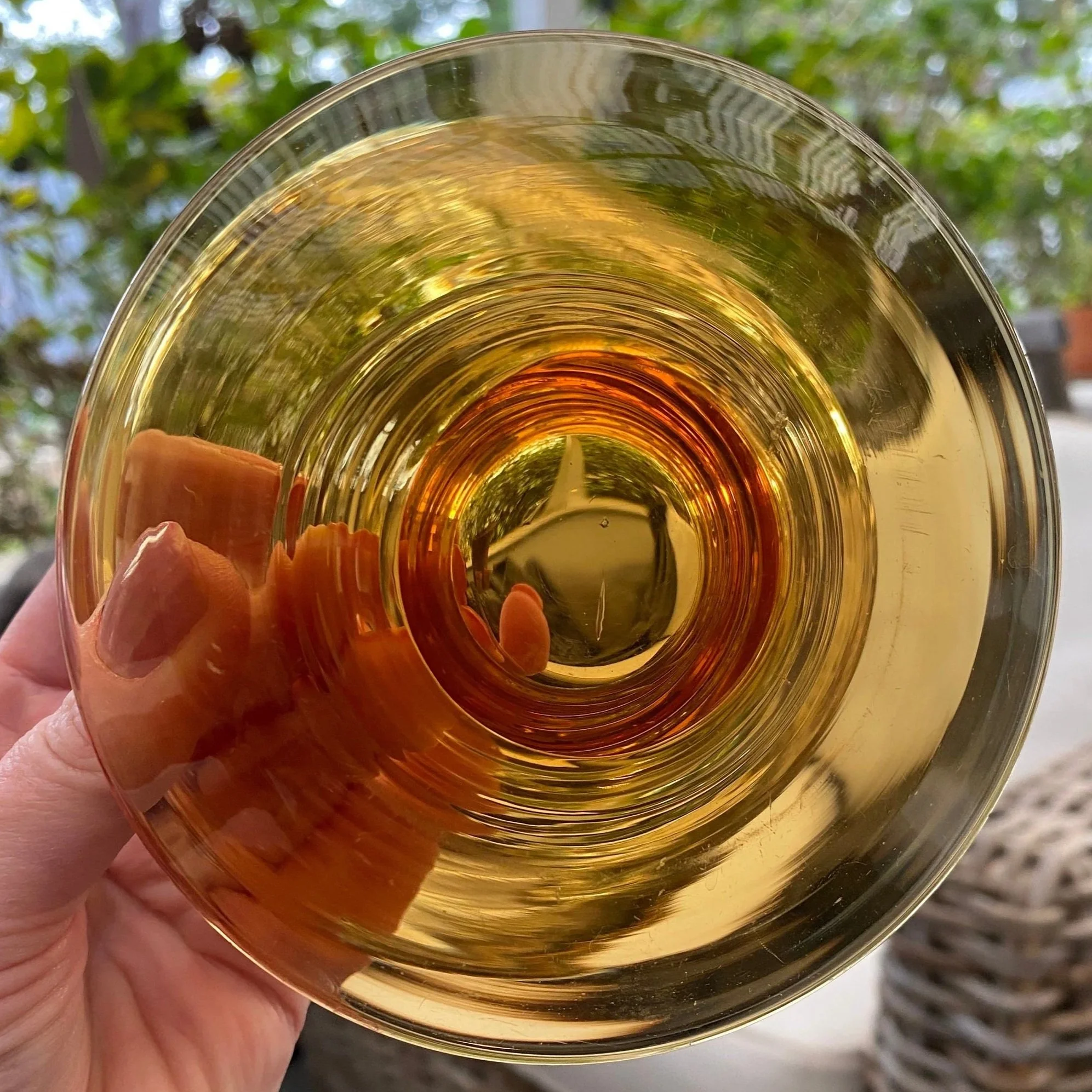 Top-down view of amber glass with radiant inner rings
