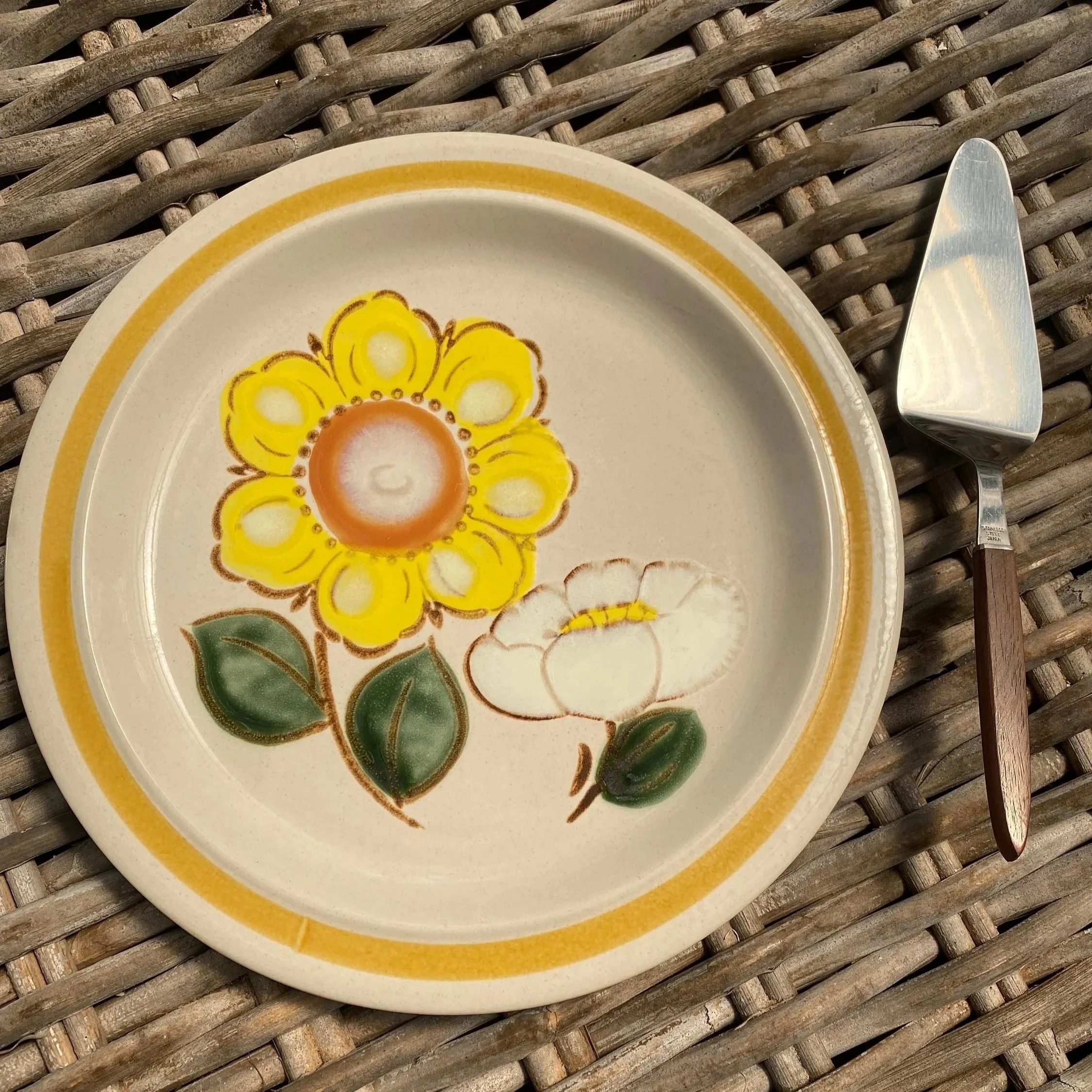 Plate and server displayed on wicker background