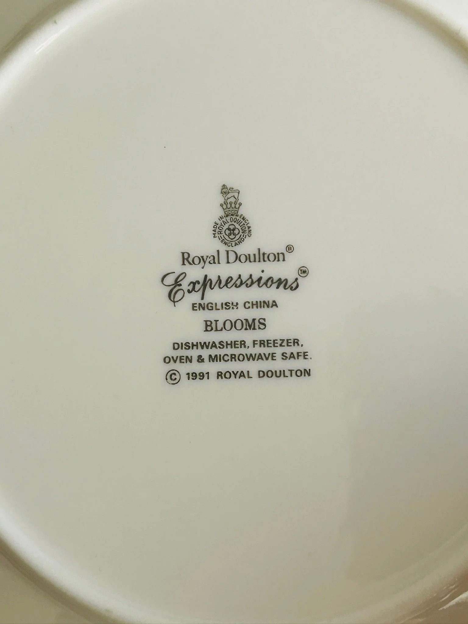 Close-up of the Royal Doulton Expressions Blooms backstamp on the underside, showing the pattern name and 1991 maker’s mark