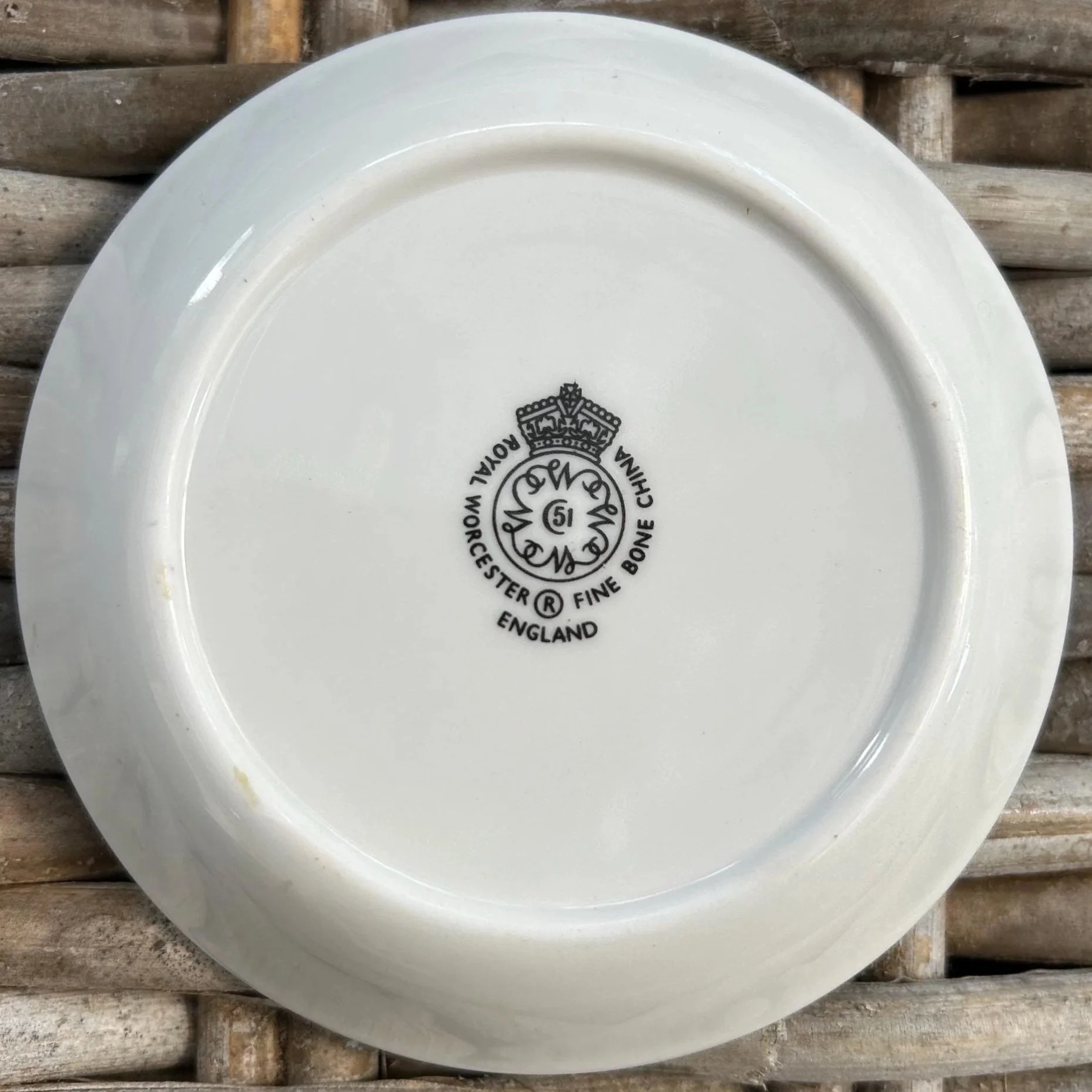 Underside view of purple flower dish with Royal Worcester backstamp