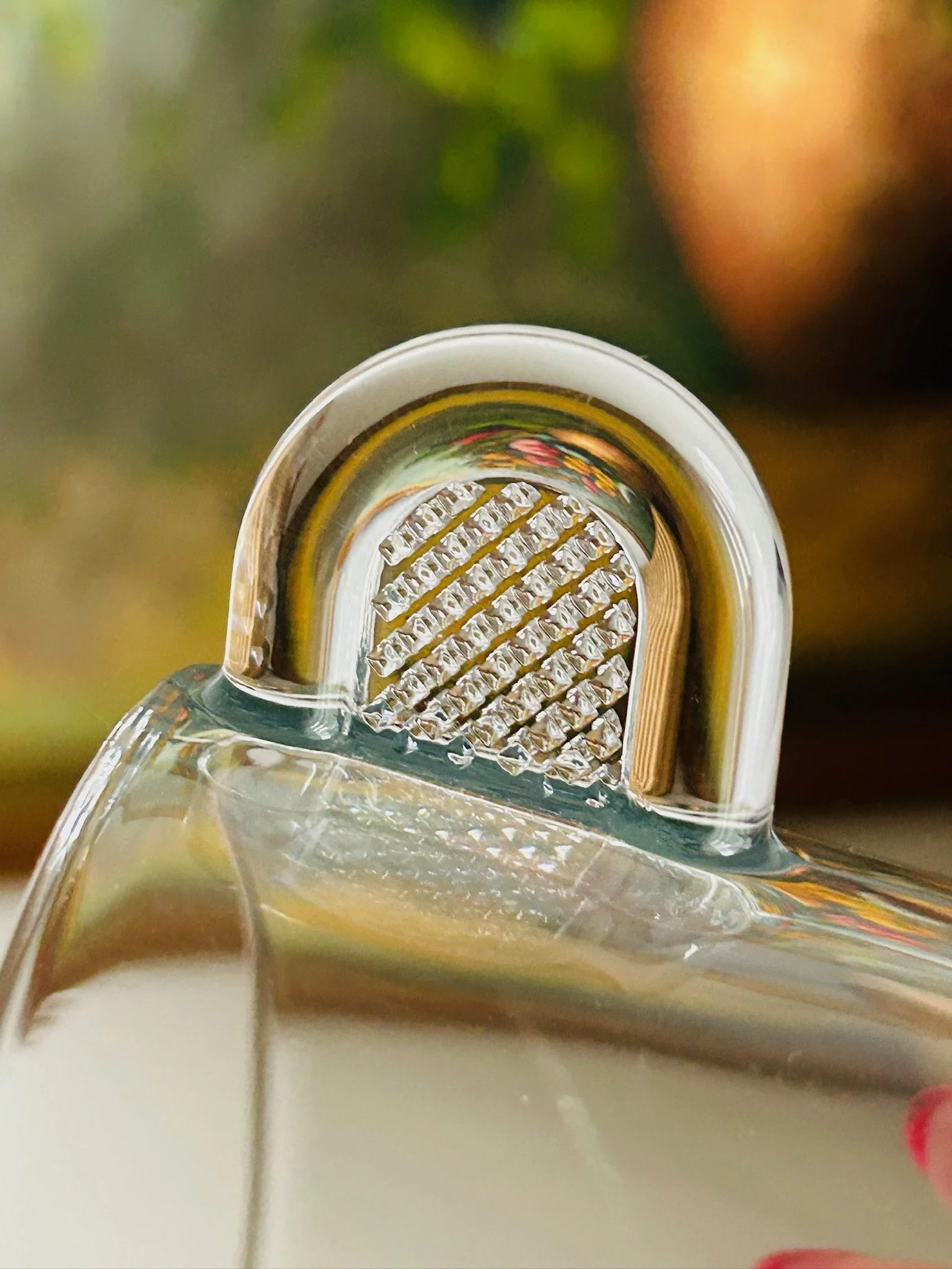 Extreme close-up of the textured handle insert on a Nespresso glass espresso cup