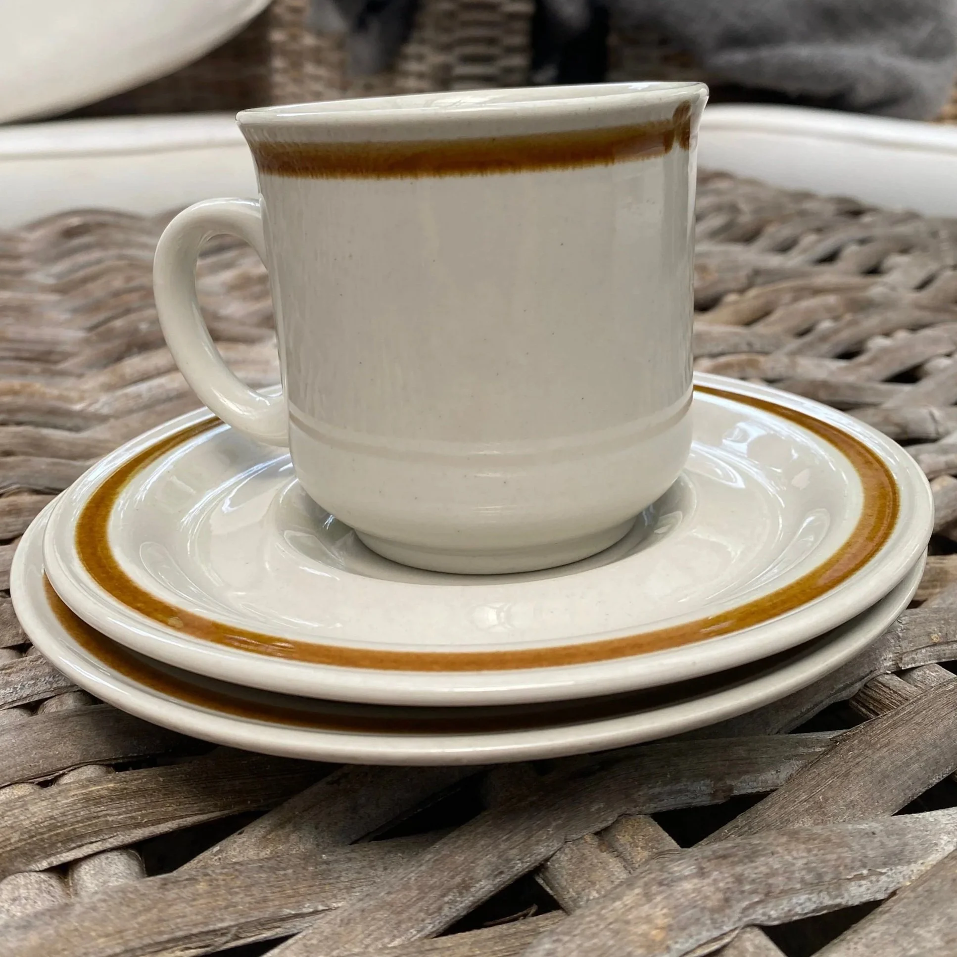 Stacked trio set showing teacup, saucer, and floral side plate