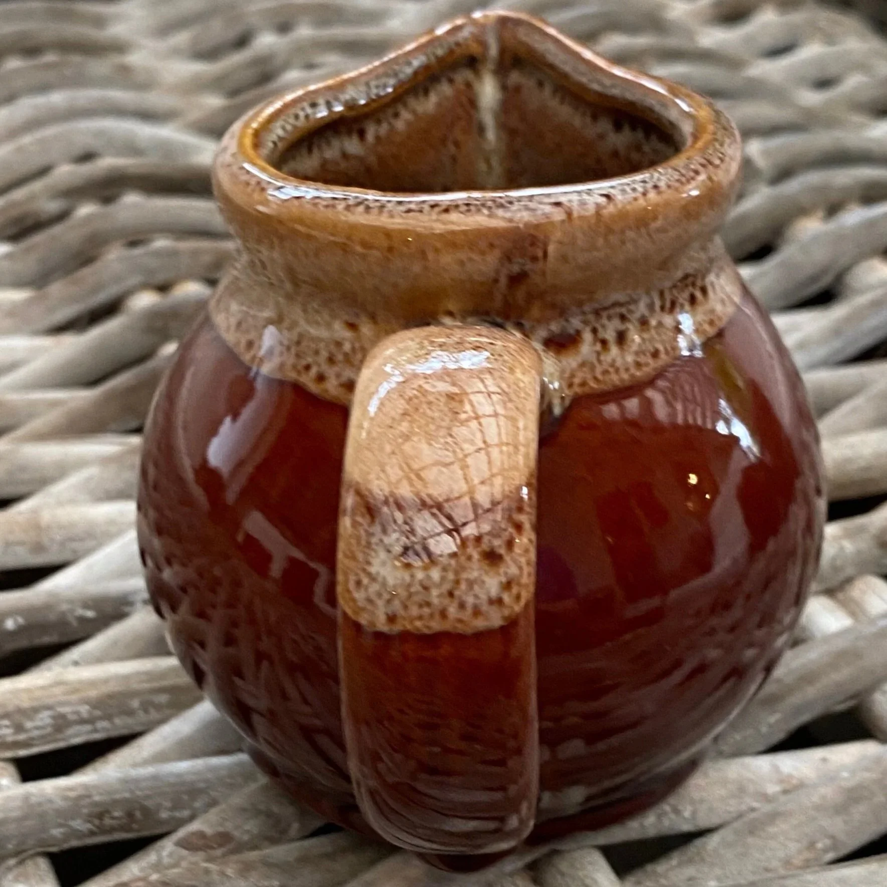 Back view highlighting handle detail and speckled glaze