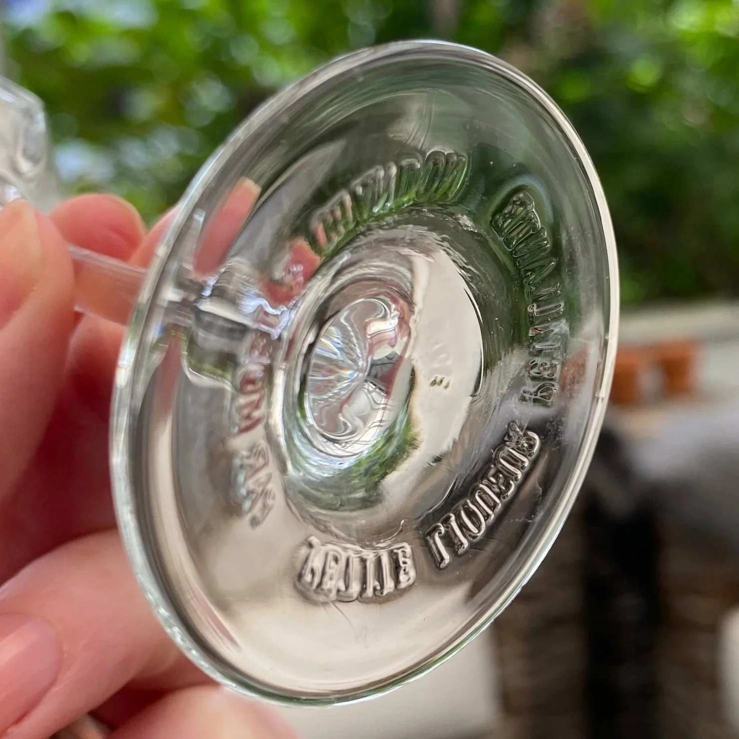 Underside of glass showing Moët & Chandon etched branding