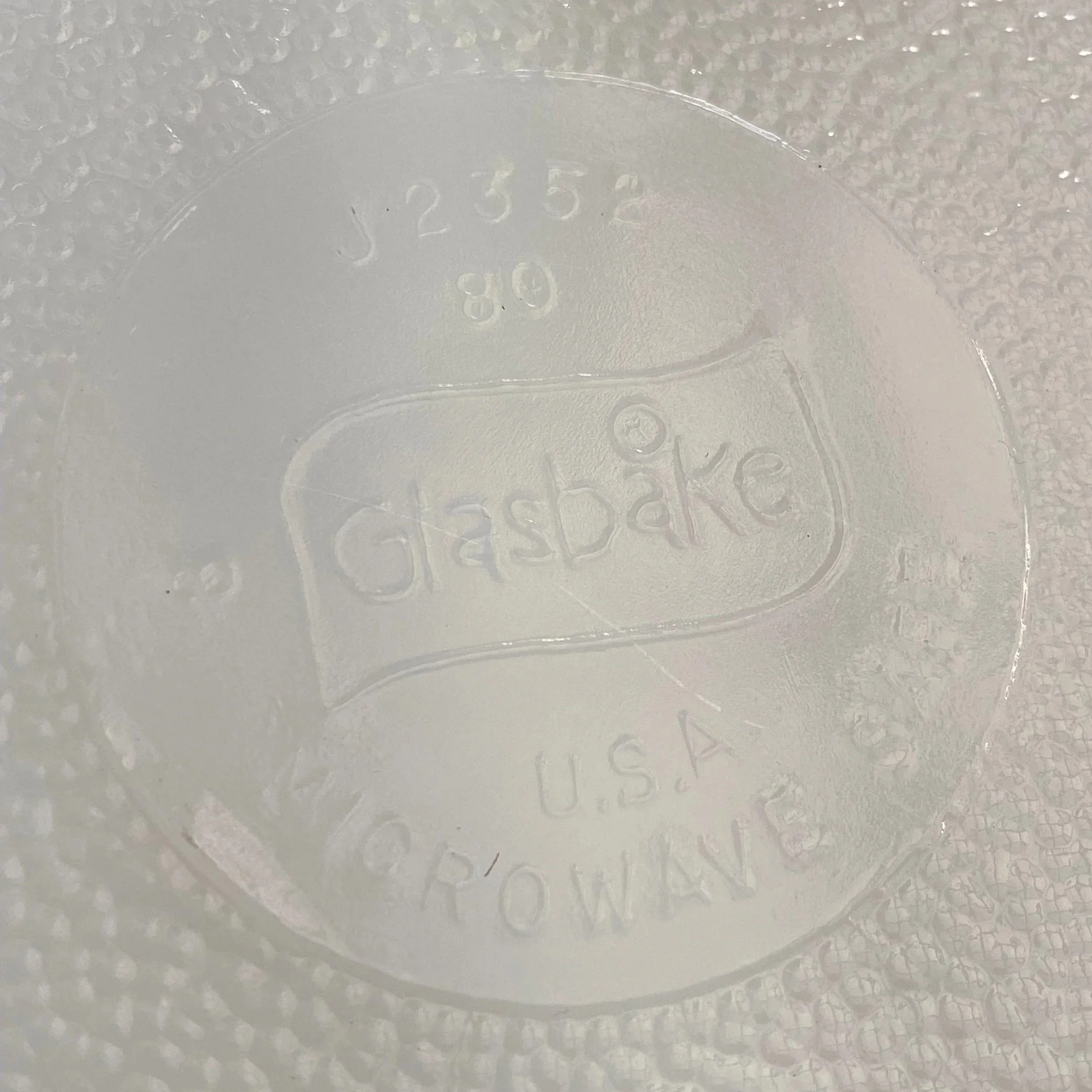 Close-up of embossed GlasBake logo and model number on base