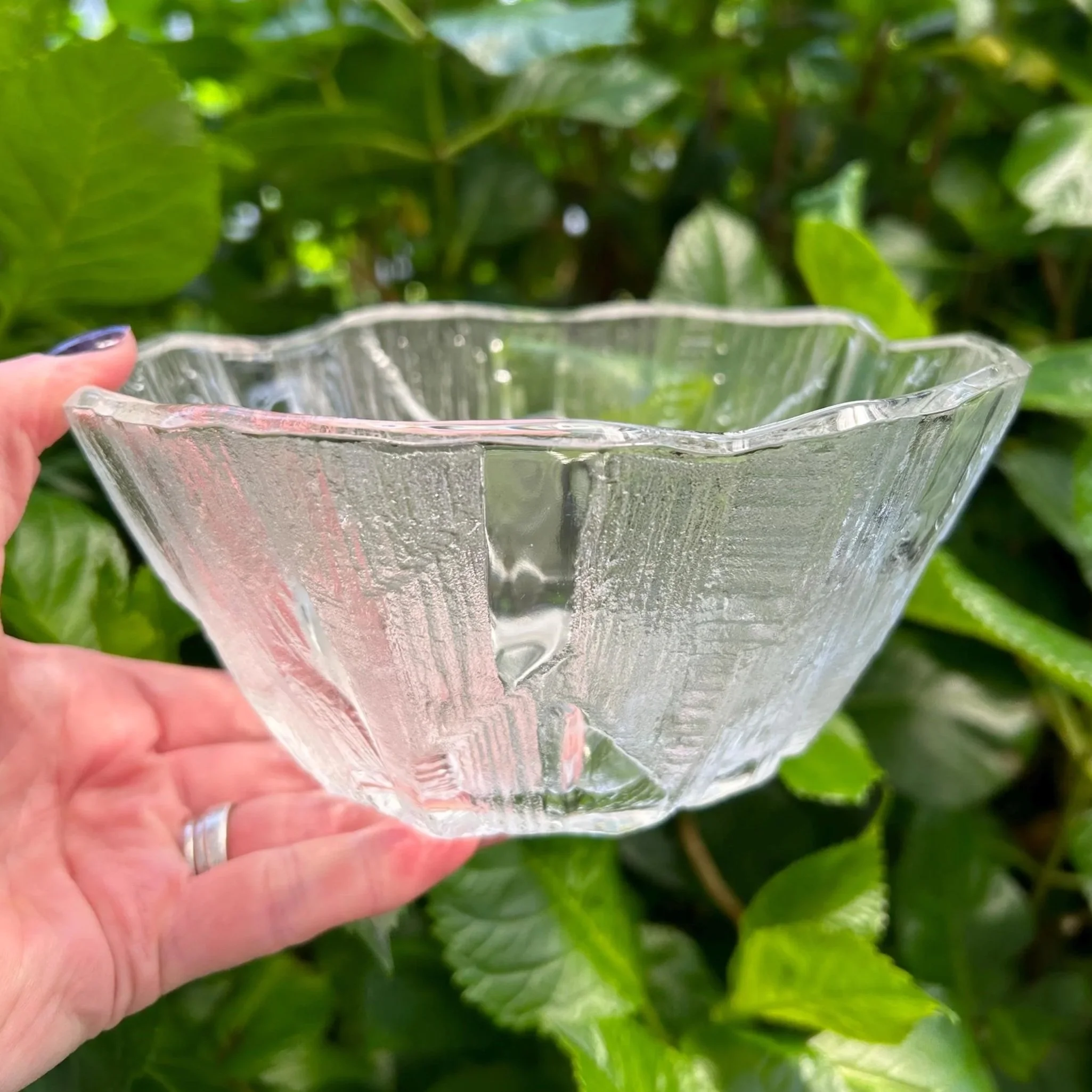 Small bowl held in hand – showing side profile and icy surface texture