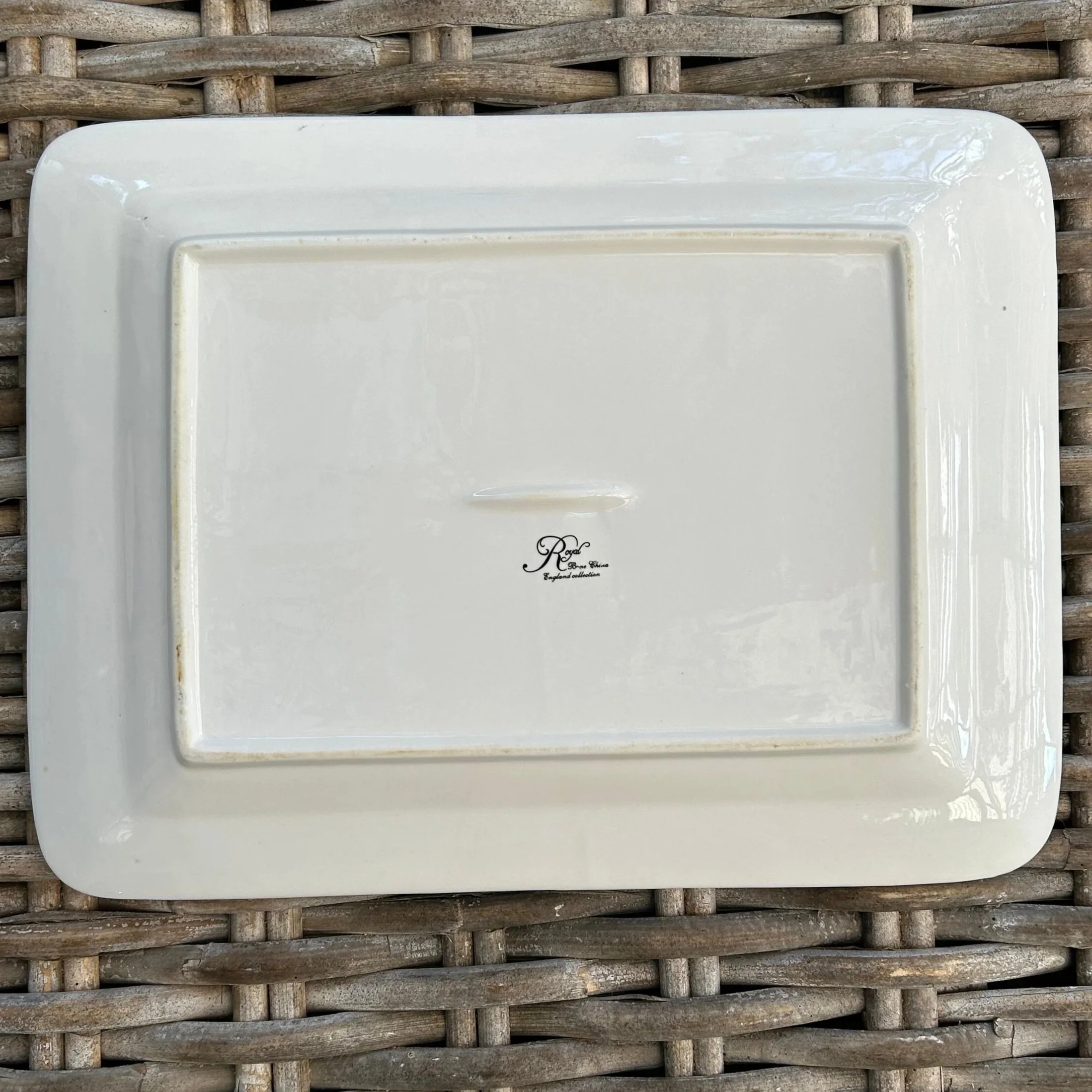 Back of the plate showing its flat base and backstamp positioning