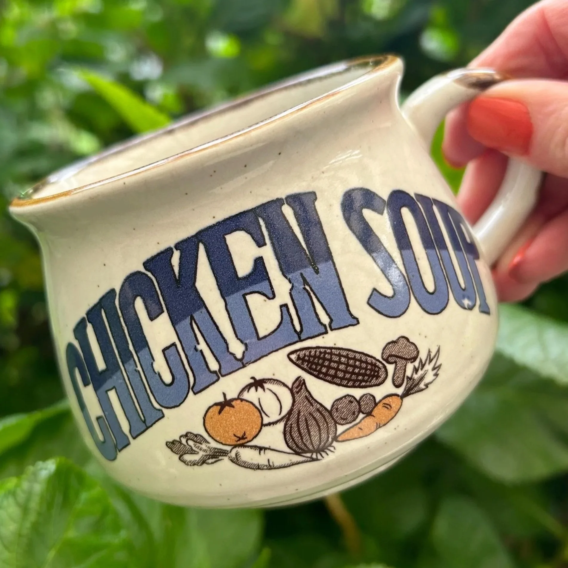 Side profile of “Chicken Soup” mug with vegetable illustrations