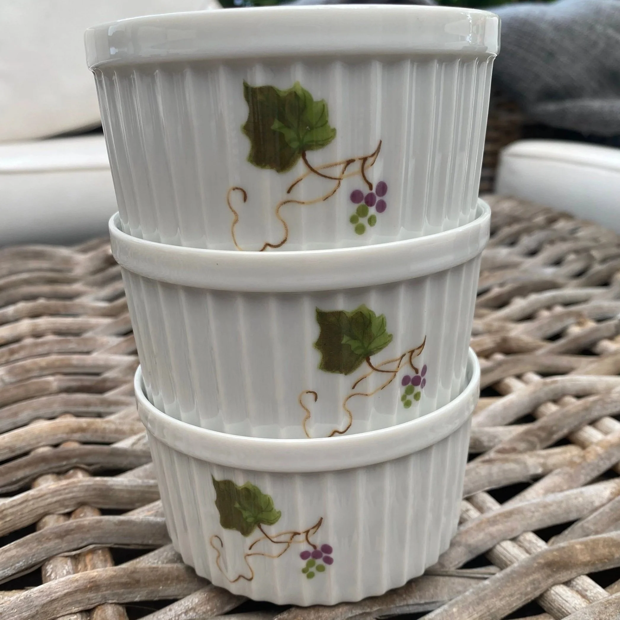 Stacked view of vintage grapevine ramekins showing fluted sides and glaze