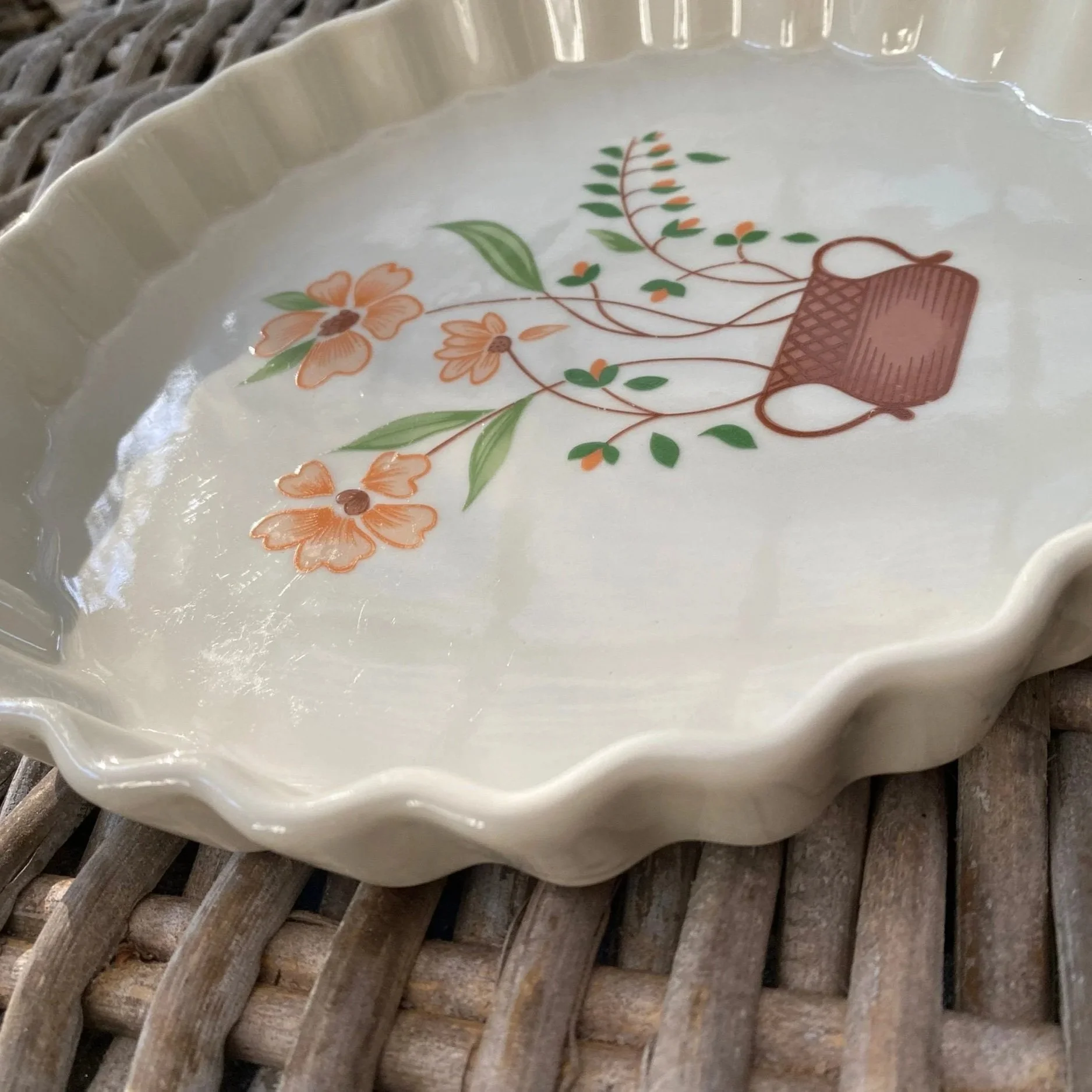 Three-quarter angle showing interior glaze and floral centre