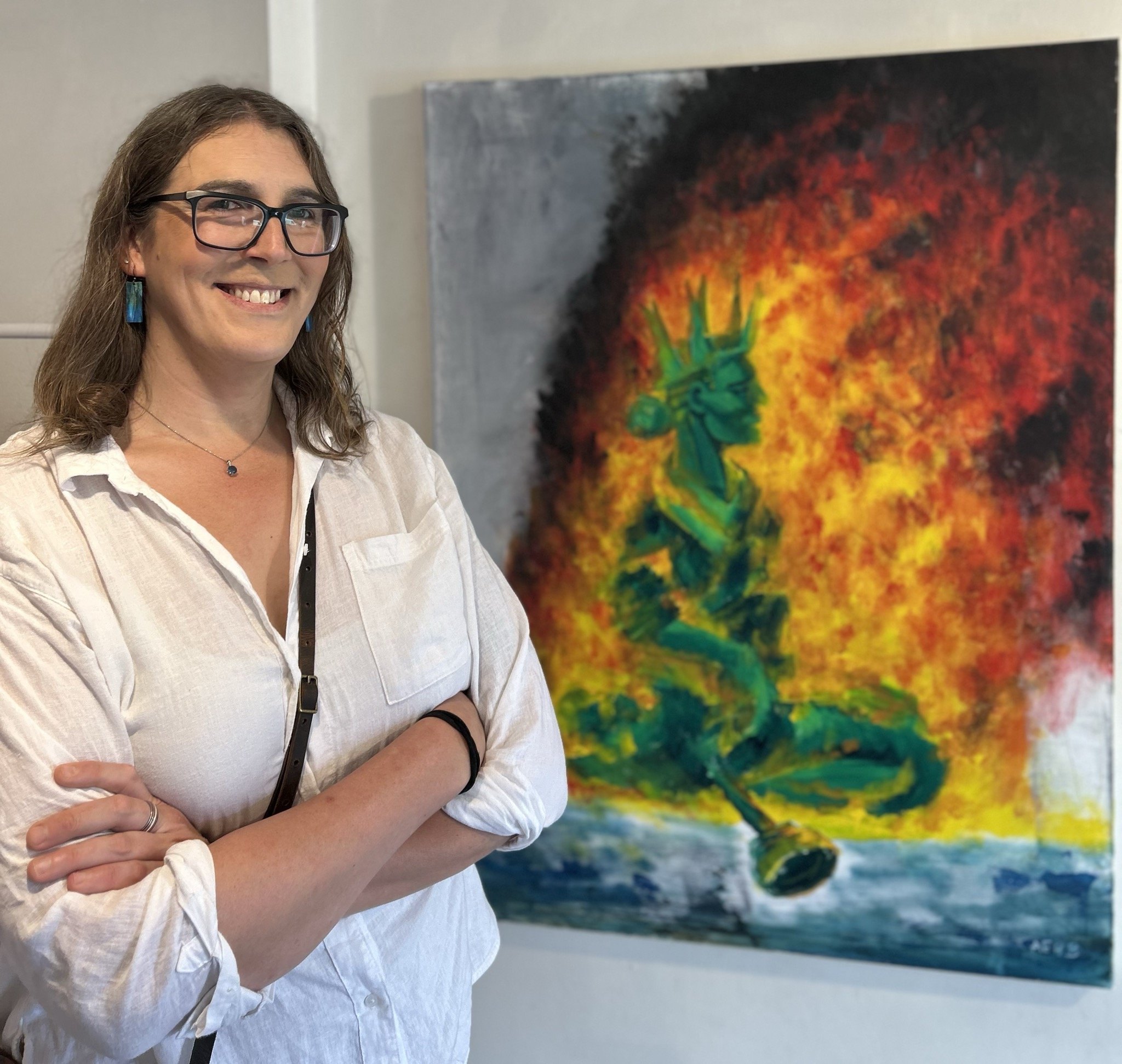 The artist, cheesing (perhaps inappropriately?) next to "The Moment." 