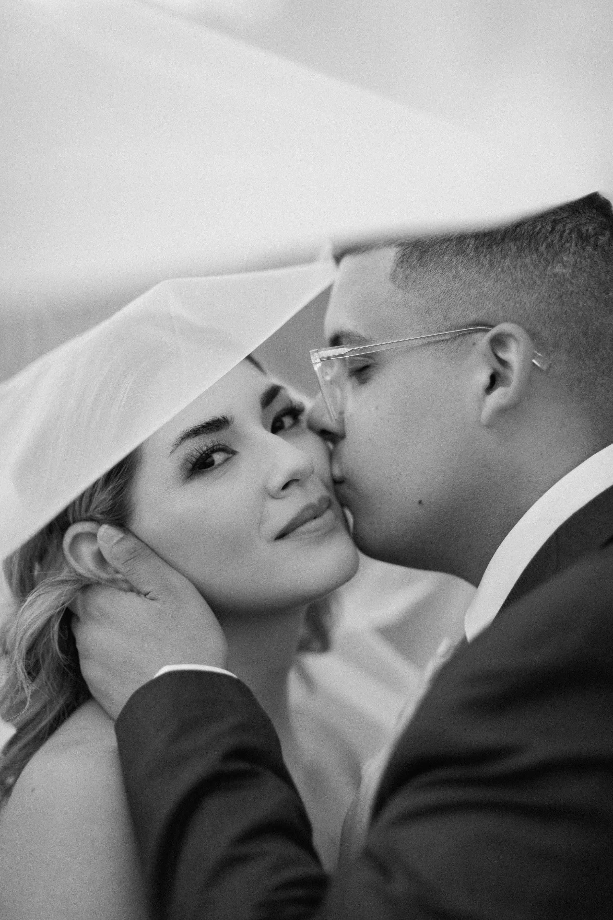 groom kissing bride's cheek.jpg