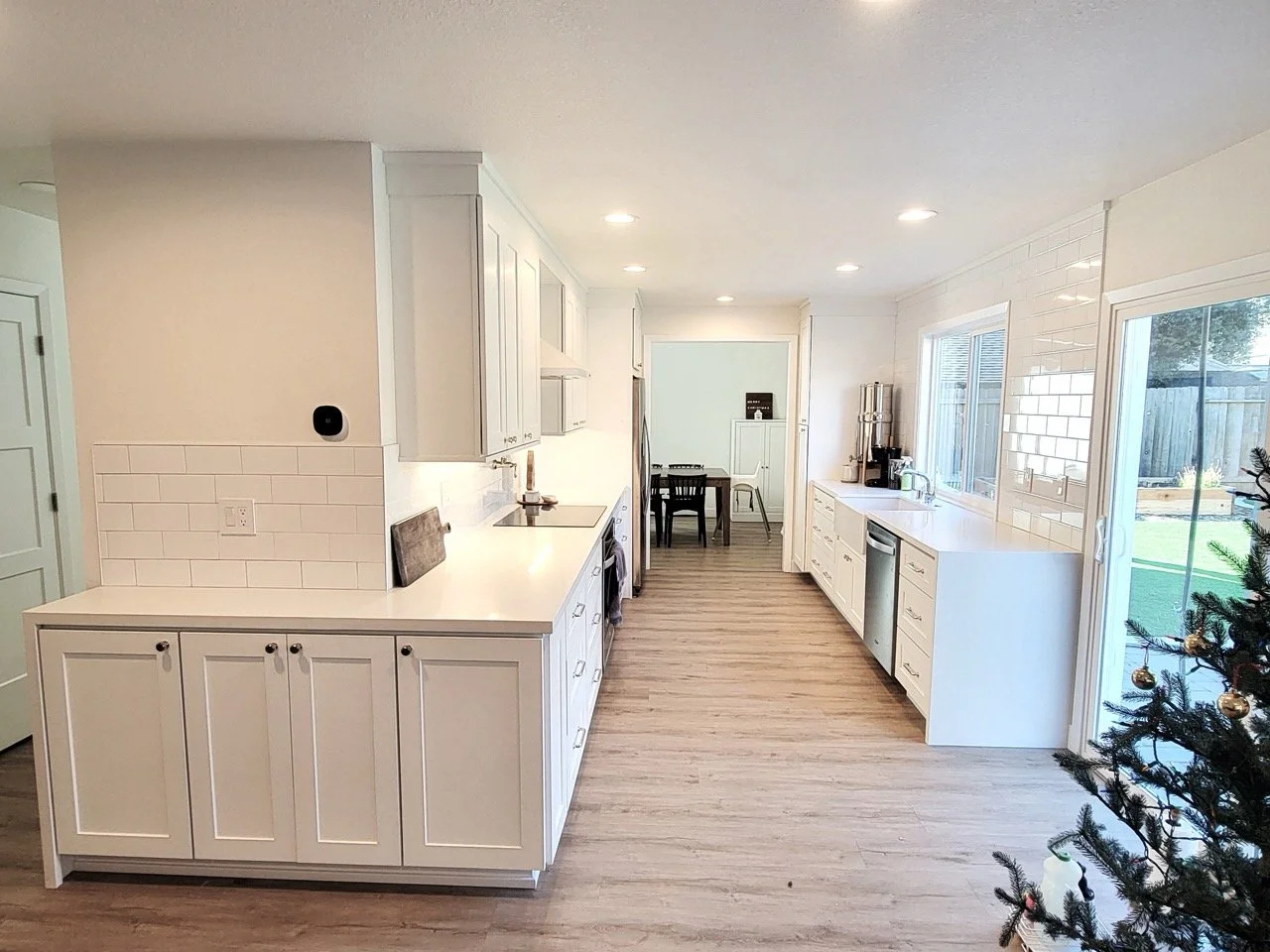 ashgray_woodfloor_whitecabinets_andwhitebrickkitchen.jpeg
