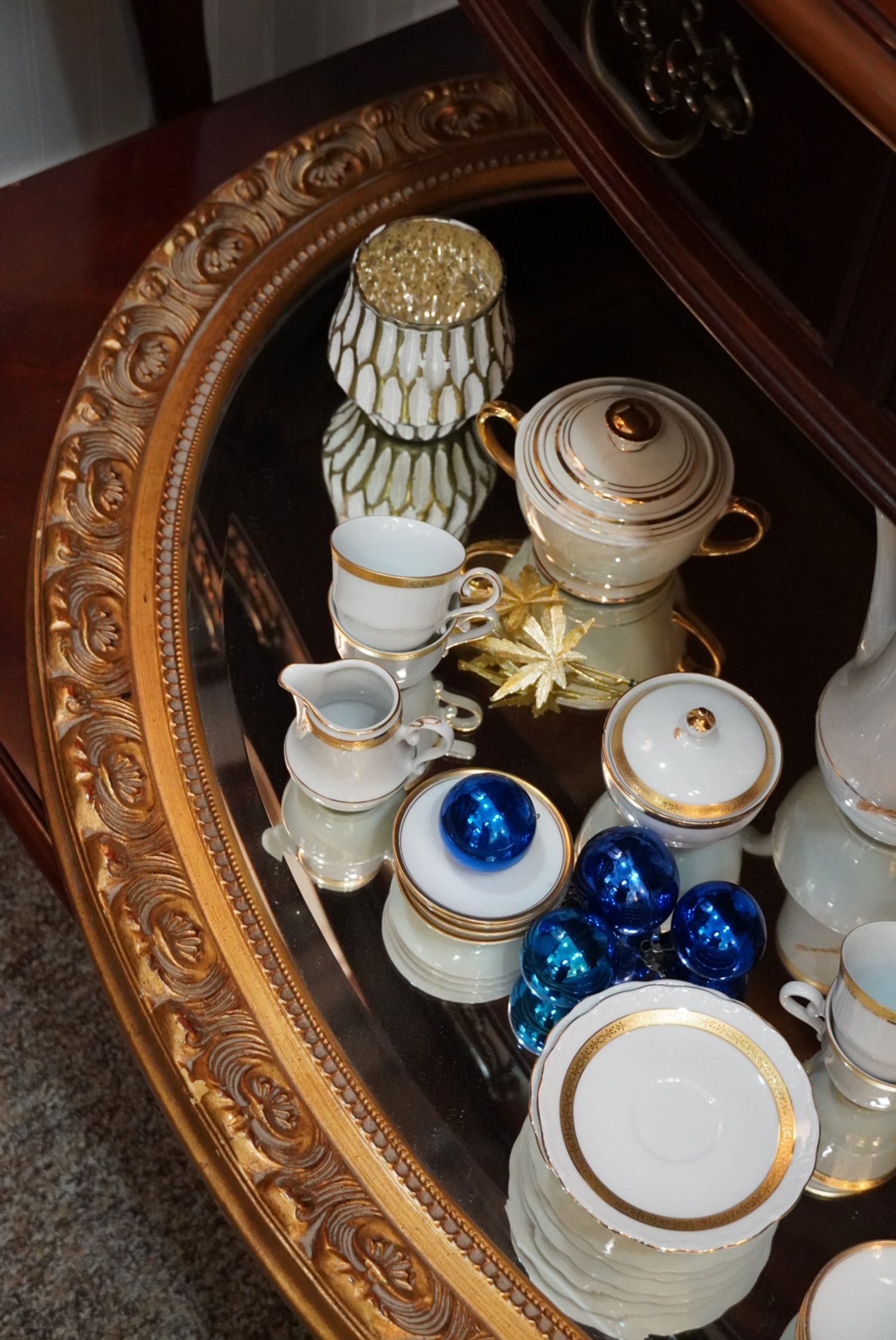 Gold mirror and delightful china