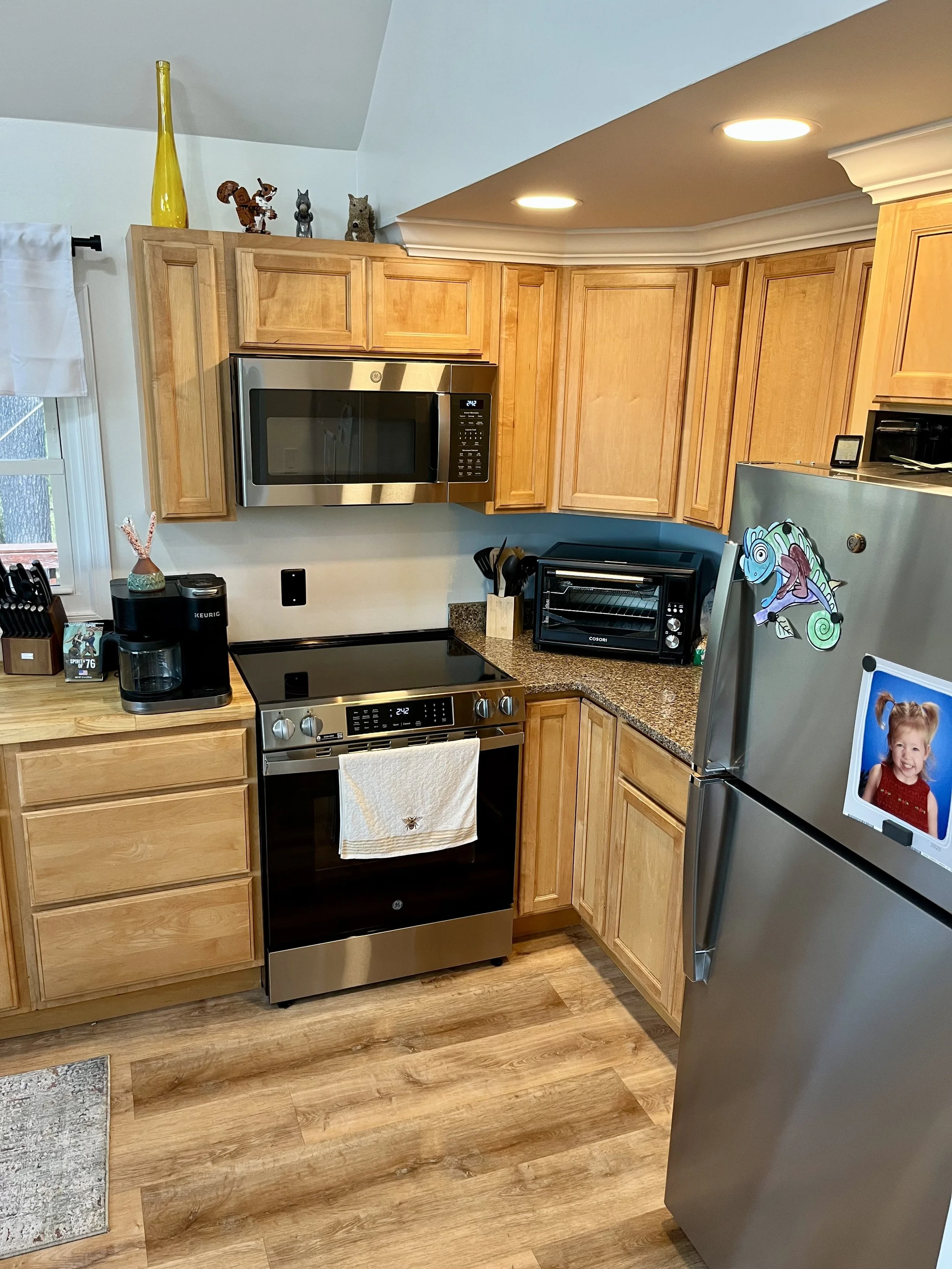 Appliances Replaced, Countertop Modified to expand the kitchen (relocated sink & added a dishwasher), Replaced Flooring with LVP, Installed crown molding.