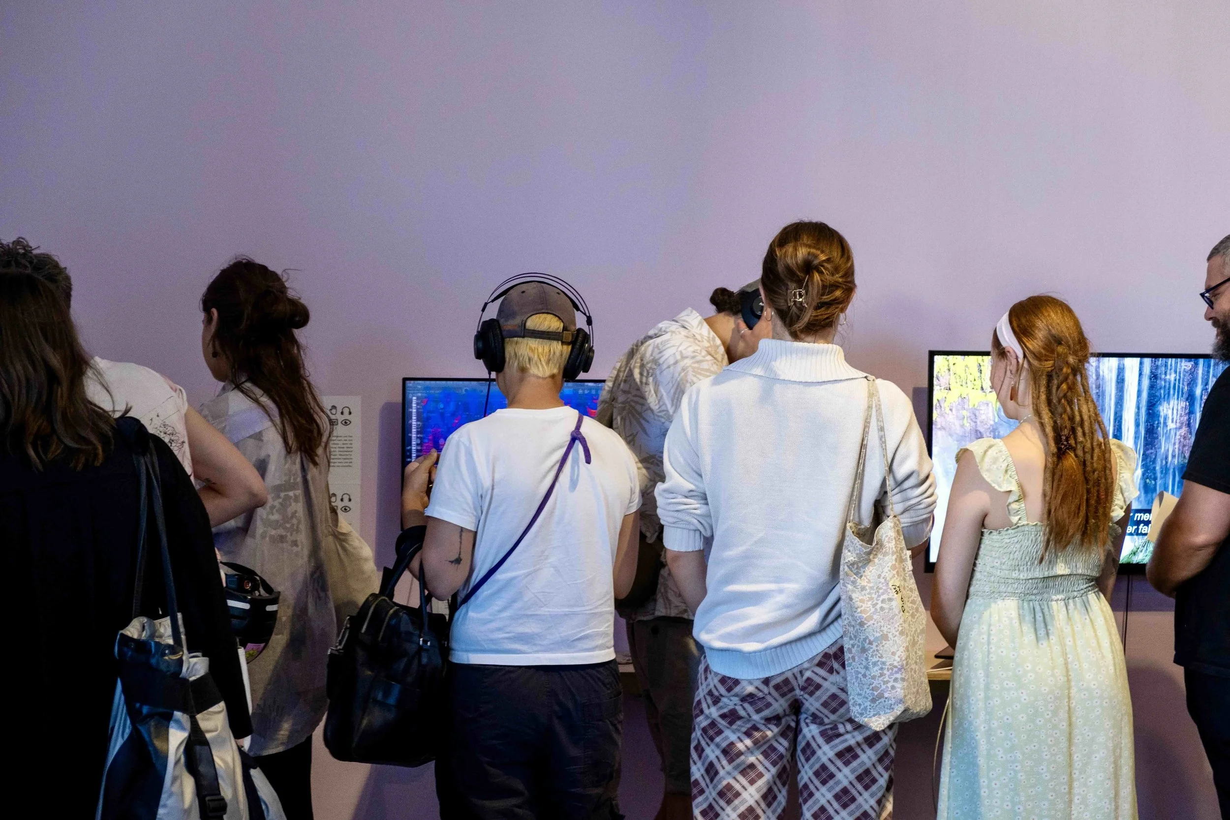 Crowd of visitors experiencing Dea’s installation. Photo: Mareike J. Lange. Event: “In Conversation” exhibition, 2025.