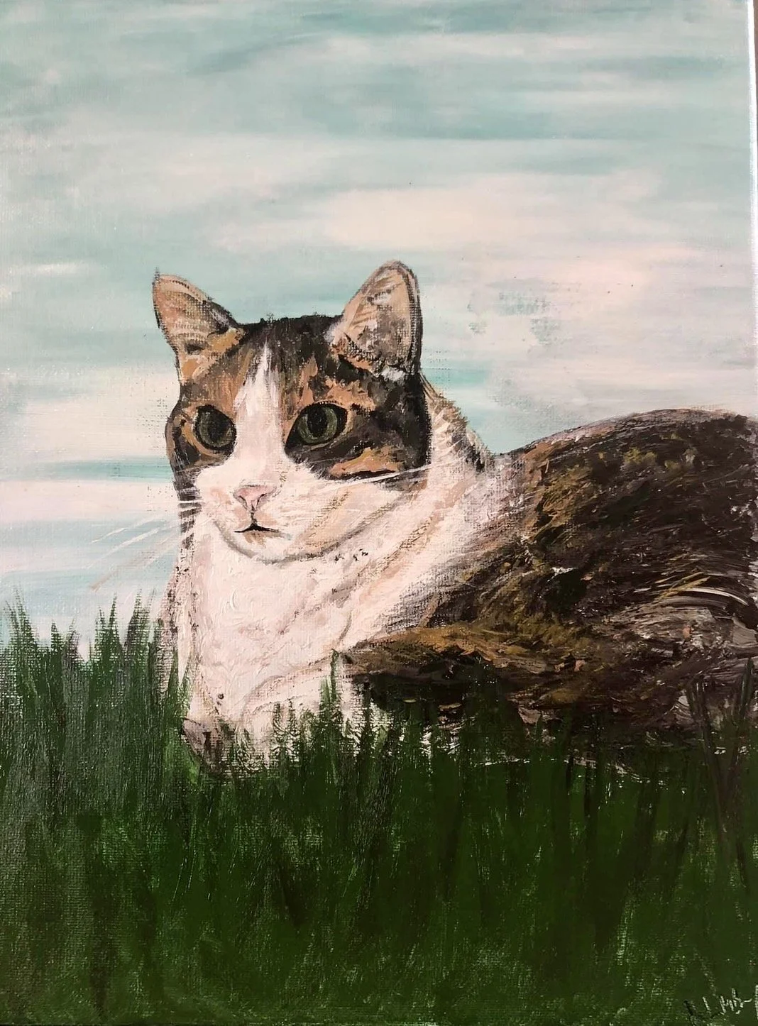 Painting of a calico cat lying on green grass with a blue sky background.