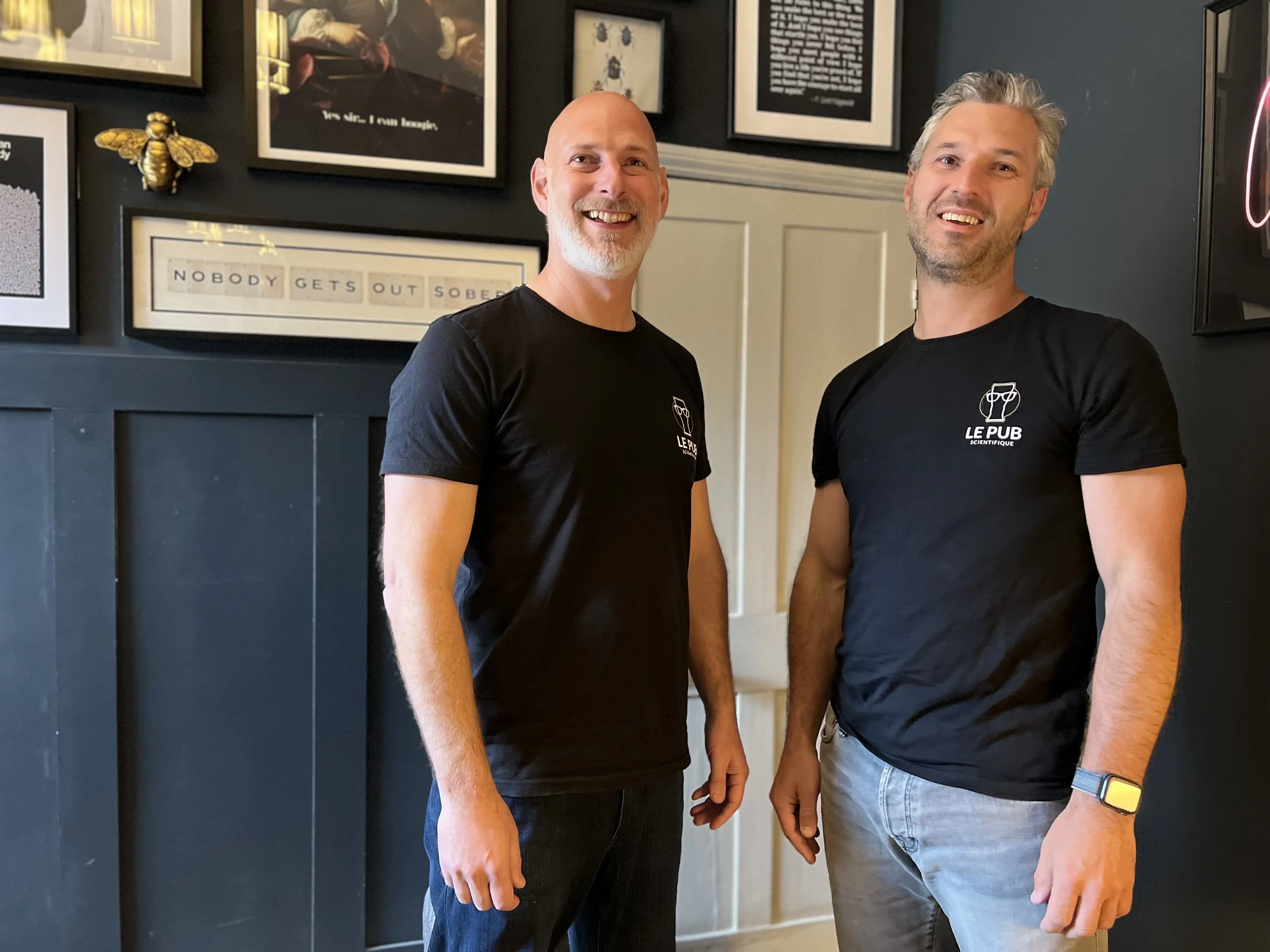 Tim Beames and Bart van Buchem, co-founders of Le Pub Scientifique, standing together and smiling, representing collaboration in advancing pain education and recovery