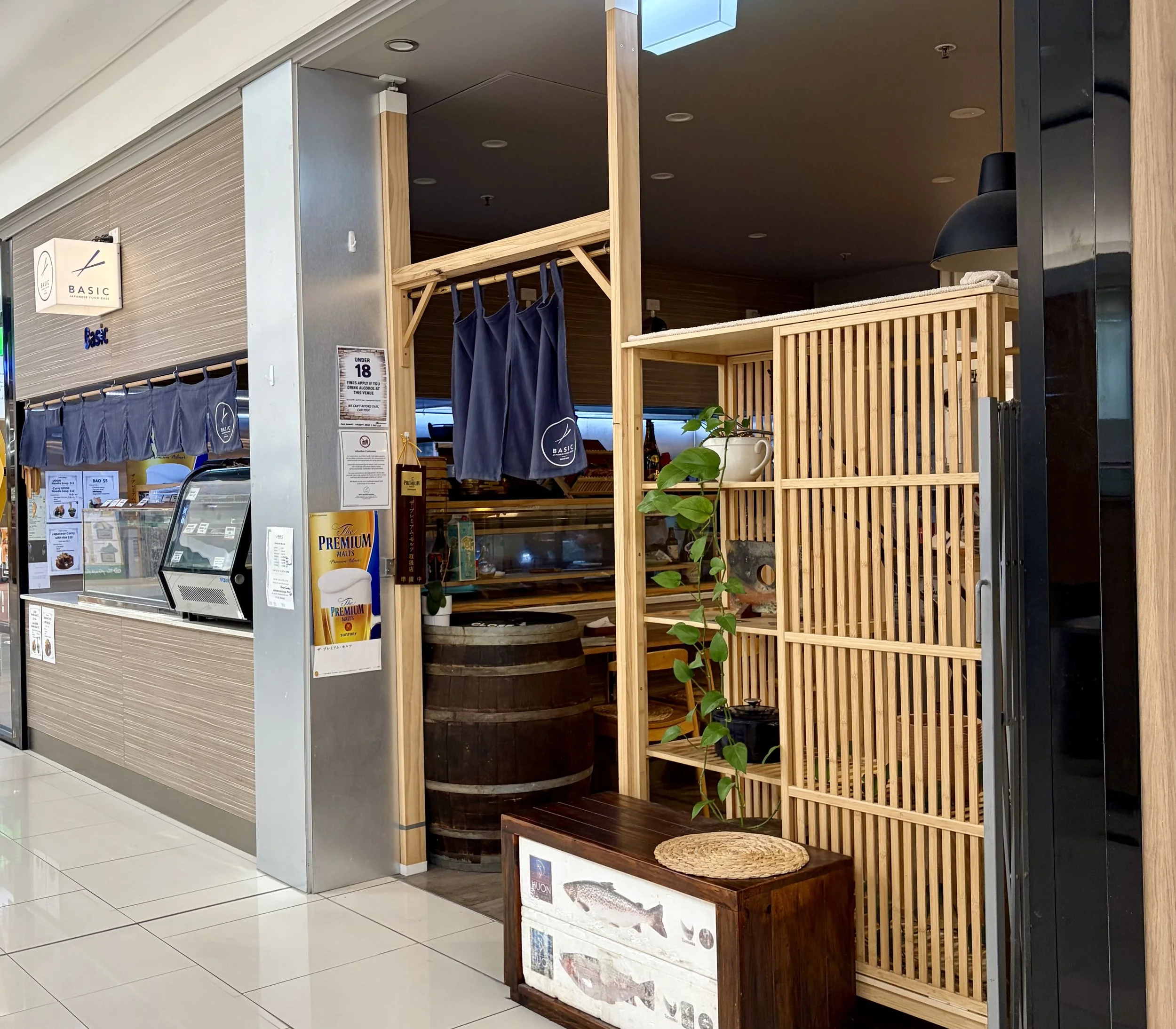 Front view of Japanese Restaurant called Basic with bamboo framed entry.