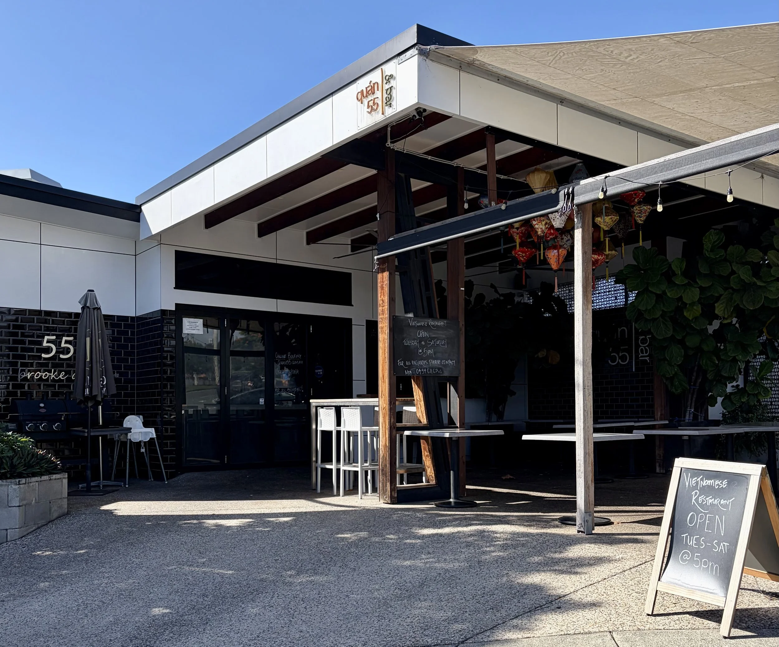 Vietnamese Restaurant & Bar, Quan 55. View from the outside looking at outdoor area at the front with hanging lanterns.