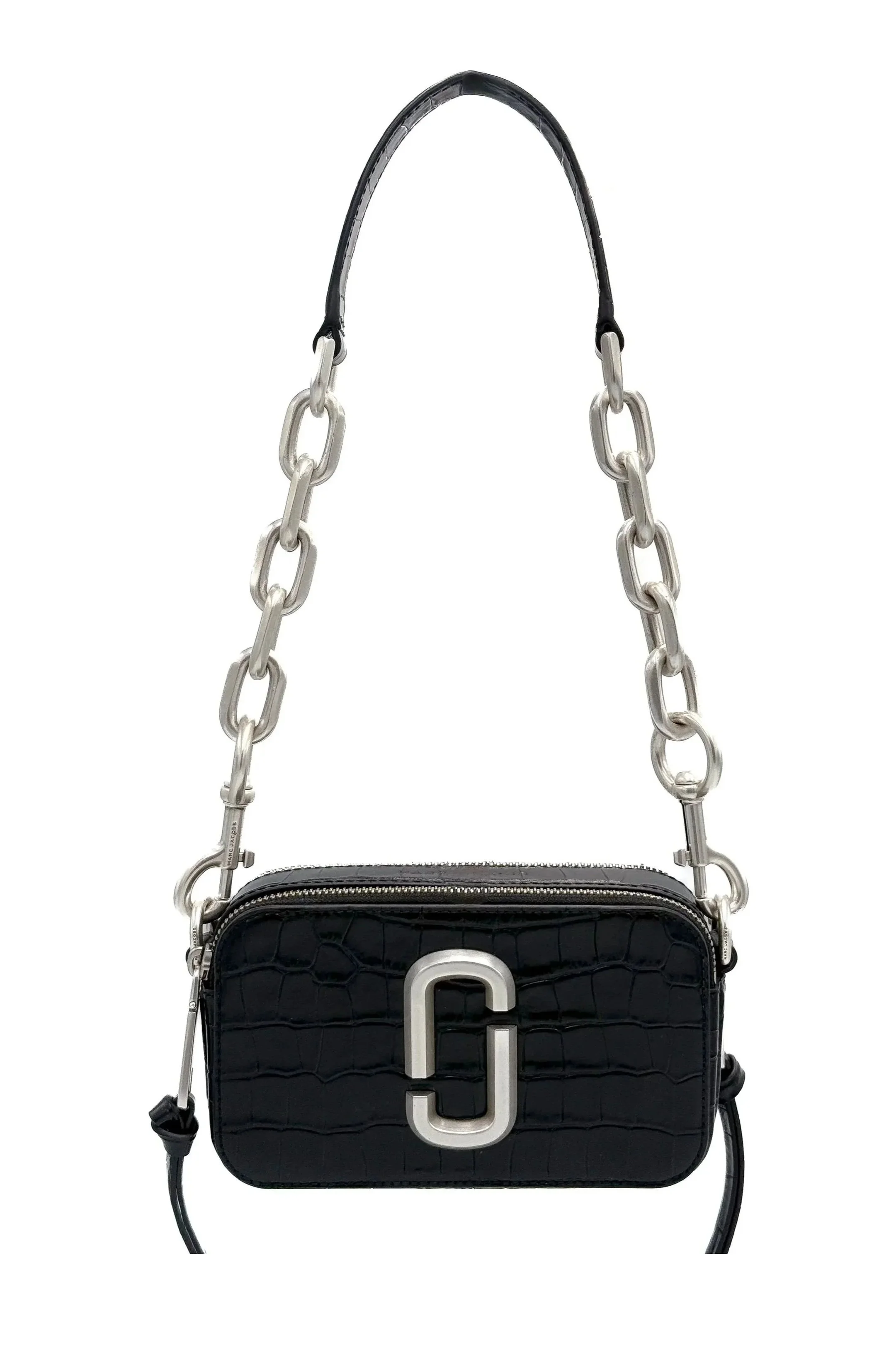 A black Michael Kors handbag with a textured pattern, a large silver logo on the front, a zippered top, and a chunky silver chain strap.