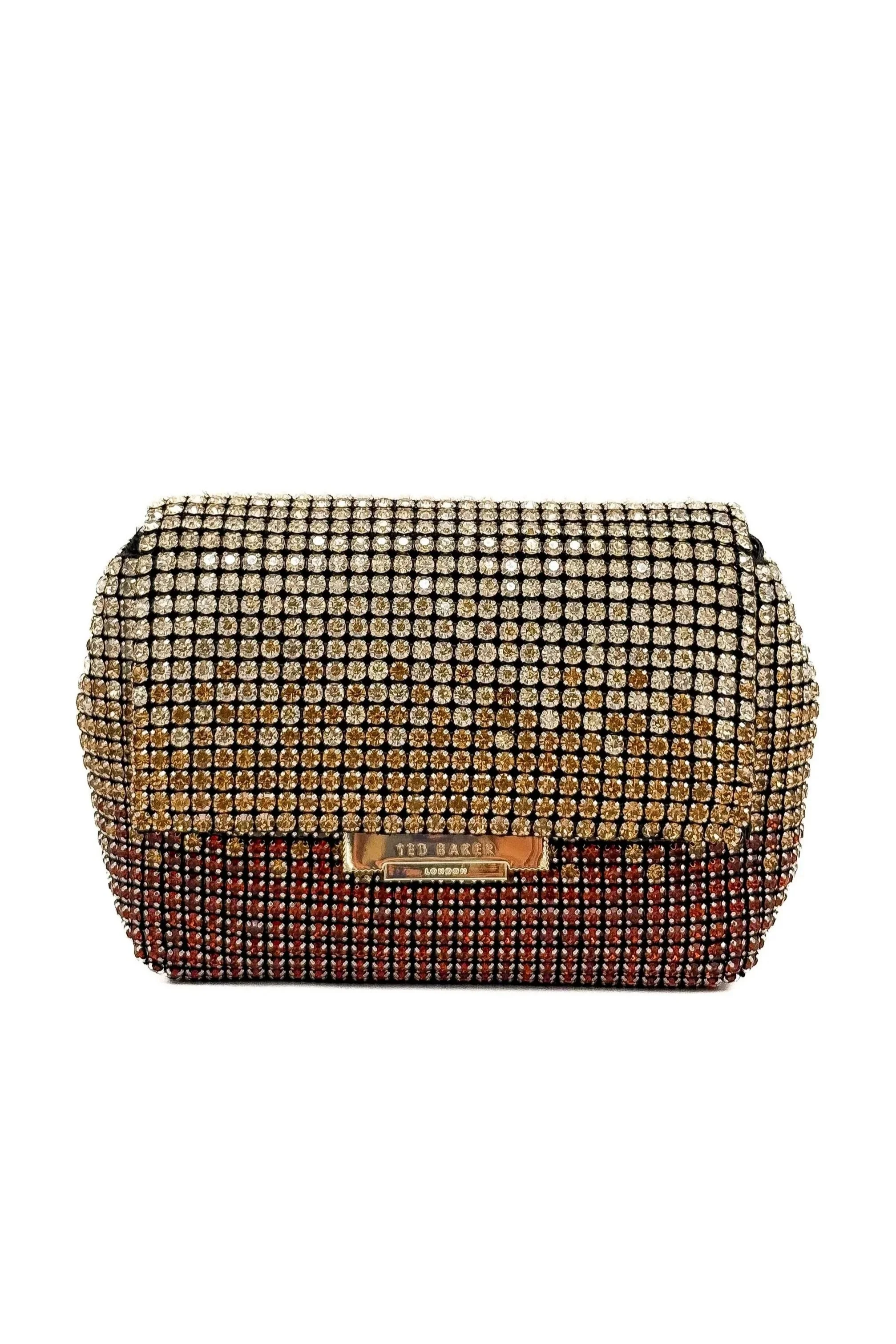 A Ted Baker clutch purse adorned with numerous crystals, featuring a metal logo plate.